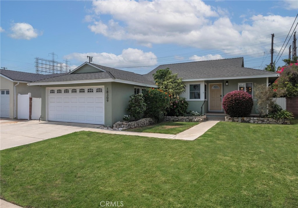 Stylish updates and everyday comfort come together in this move-in-ready 3-bedroom, 2-bath home nestled in the heart of Northwest Torrance. Set on a 5,201 SF lot, this 1,615 SF residence has been thoughtfully refreshed with modern touches that make daily living both functional and enjoyable. Step inside to find freshly painted interiors, recessed lighting, and a spacious layout that flows easily from room to room. The generous family room—anchored by a charming pot belly gas stove—opens directly to the backyard, creating a warm and inviting indoor-outdoor living experience. Out back, enjoy low-maintenance landscaping with artificial turf and bistro lights—perfect for relaxing, entertaining, or playtime without the upkeep. Recent upgrades include a new electrical panel, newer furnace and A/C for year-round comfort, water purifier, and a Tesla charger for easy EV charging at home. Located in a friendly, established neighborhood near top-rated schools, parks, shopping, and dining—with easy access to the 405 for commuters—this home blends style, comfort, and convenience in a way that’s hard to beat.