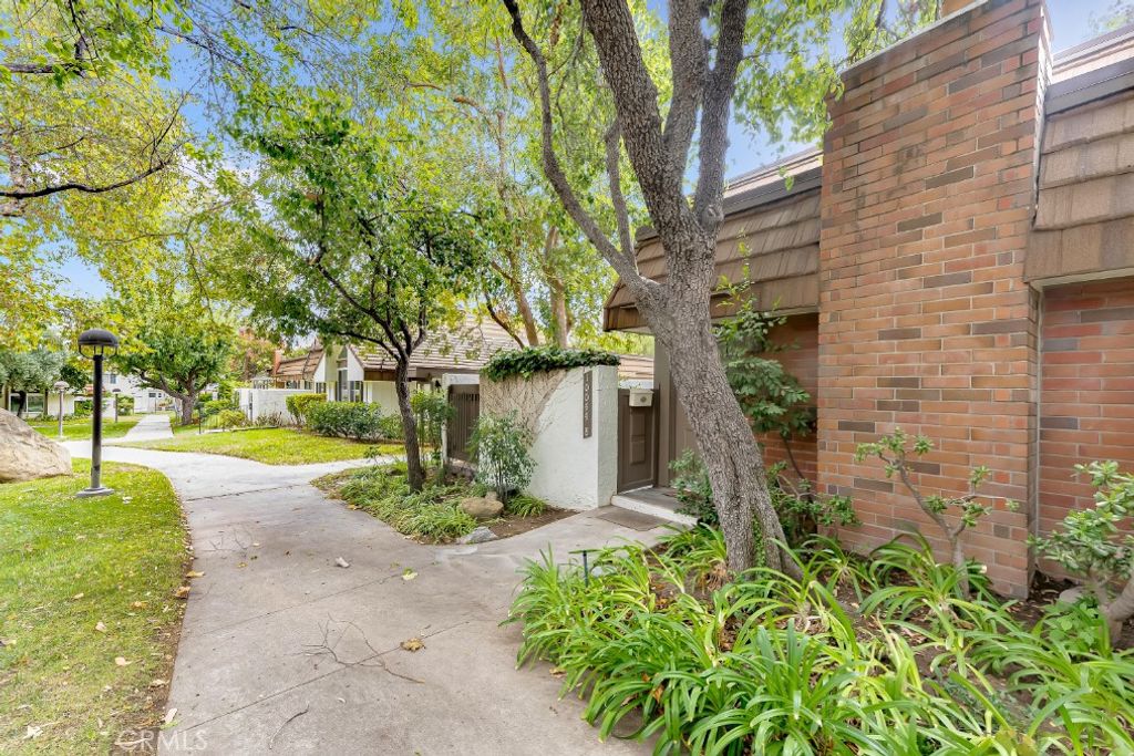 Photo of 10044 Larwin Avenue #8, Chatsworth, CA 91311 (MLS # SR25220787)