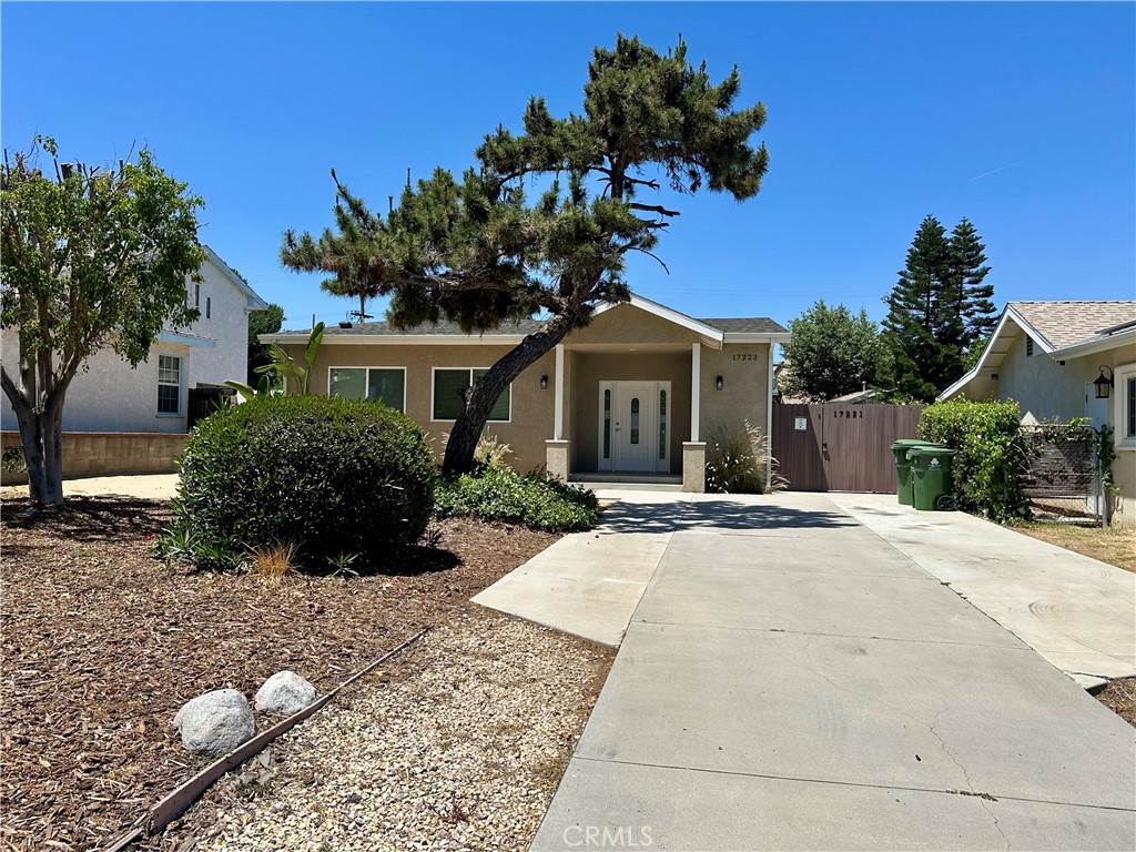 Welcome to this beautifully crafted custom home, built in 2015 and ideally situated in the highly sought-after Granada Hills neighborhood. One of just two custom residences on a spacious lot, each home enjoys its own private address, entrance, and parking—offering both privacy and convenience. The completely private front home, now available for rent, features 3 bedrooms and 2 bathrooms across approximately 1,650 square feet of bright, open living space. Enjoy excellent curb appeal with drought-tolerant landscaping, a drip irrigation system, and a long driveway that offers RV access or space for multiple vehicles. Designed with an open-concept layout, the home boasts a spacious chef’s kitchen complete with modern white shaker cabinetry, granite countertops, stainless steel appliances, and an oversized island—perfect for casual family meals or entertaining. A separate dining area comfortably accommodates guests for more formal gatherings.The expansive great room is filled with natural light thanks to cathedral ceilings and a skylight, providing a warm and inviting space for family and friends. Additional highlights include LED lighting throughout, newly installed laminate flooring in all bedrooms, dual-pane windows, and a new central heating and air system. Each room is hard-wired for internet, and a private laundry area offers ample storage with convenient side yard access.The impressive primary suite features dual walk-in closets, a newly remodeled en-suite bathroom with a stylish vanity and tiled shower, and direct access to the backyard. Two additional generously sized bedrooms share a beautifully updated guest bathroom. Step outside to a private backyard with a covered patio and fresh drought-tolerant landscaping—perfect for relaxing or entertaining. Located within walking distance to the award-winning Granada Hills Charter High School, local dining, and the popular Friday night Farmer’s Market, this home offers the perfect blend of comfort, style, and location.