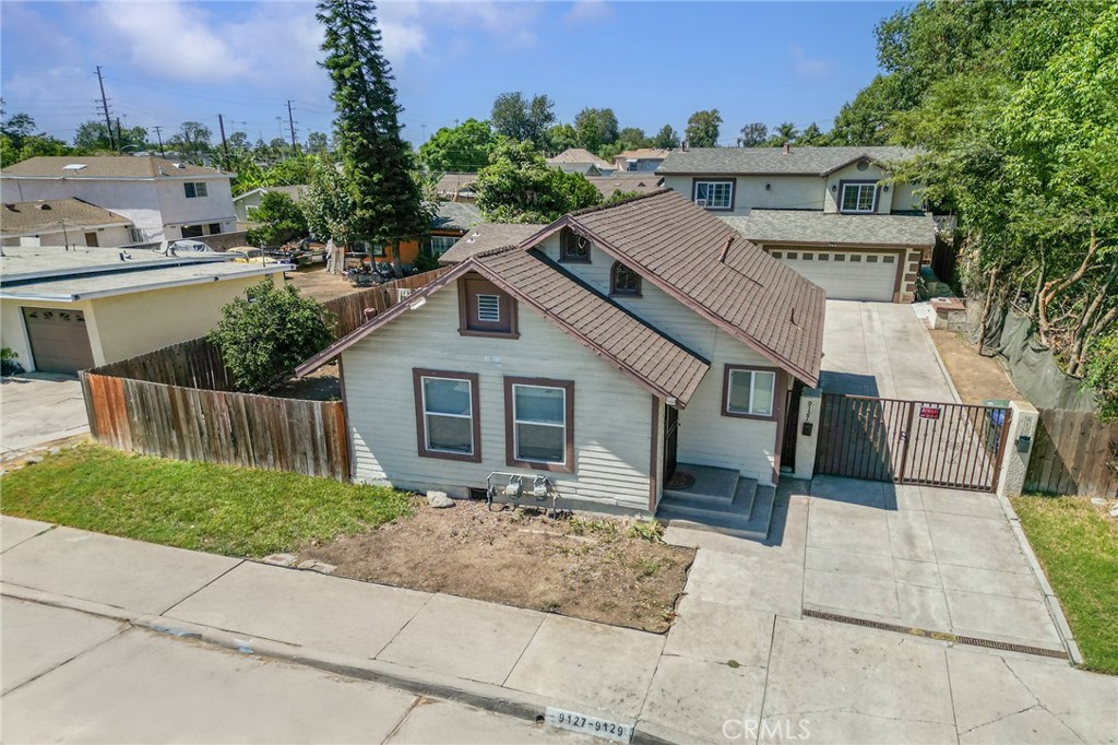 Attention all investors and owner users, this 2 on a lot, residing in the city of Whittier, you can live in one and rent out the other, or rent out both for immediate cash flow. Tenants pay for all utilities; all meters are separated. It is gated, with a nice1 cement driveway, the front unit is single story, with 2 bedrooms and one bath, along with a 2-car detached garage, and a spacious yard. The rear unit is a 2-story home with a 2-car attached garage, 3 bedrooms, 2.5 baths, and an open concept.