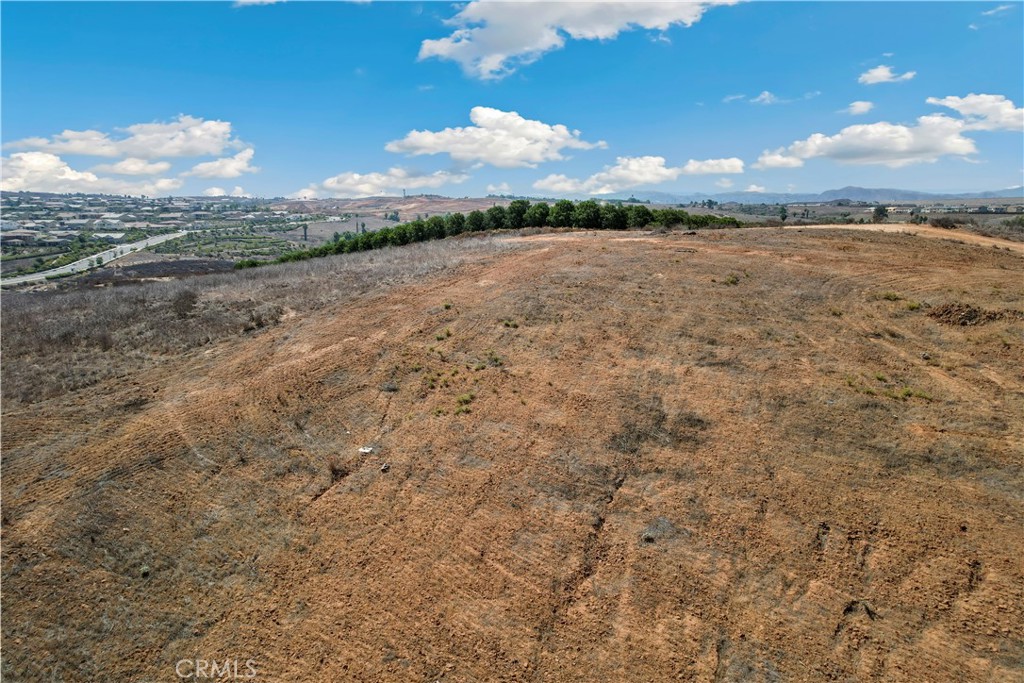 Large Riverside Lot with Panoramic Views – Build Your Dream! Don’t miss this rare opportunity to own 16,117 sq. ft. (0.37 acres) of prime residential land in the highly desirable Riverside Unified School District. Zoned R-A-1 (Residential Agricultural), this spacious lot offers endless possibilities—build your custom estate, create a multi-generational property, or develop a unique investment project. Set in a peaceful rural setting with stunning hill and mountain views, the property combines natural beauty with convenient access to schools, shopping, dining, and major freeways. For those with a bigger vision, the seller is also offering the adjacent lot at 57 Via Verrazano for sale—perfect for expanding your property or developing multiple homes.