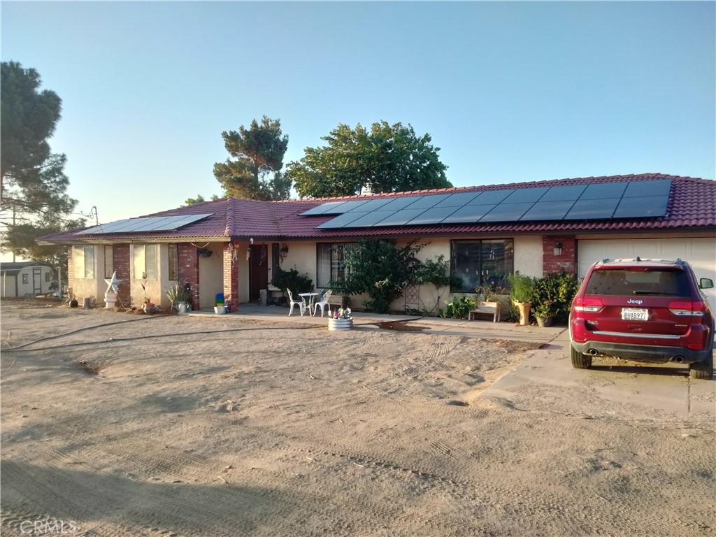 Mountain view ranch home on 4.4 total acres of improved horse property located in Pinon Hills. This ranch home is ready for horses and has pool, 3 bedrooms, 2 bathrooms, 2 car attached garage and additional 50x75 sq ft steel shop building, 4 stall barn with tack room, 230x120 sqft arena and 55ft round pen, owned Solar, 500 gal propane tank, 40ft Americana theme windmill, flag pole, and additional 2.33 acres lot (apn #3067-531-21-0000) with address 2426 Trinity Rd. The 3750 sqft steel building has 100Amp electricity and water, two 14ft high roll up doors, and is ready for interior spaces. The barn has 4 12x12 stalls with avg. 24x24 outdoor runs, tack room, and additional open area for hay or storage space. The 4.4 acres are fully fenced with 7 car gates and 5 walk in gates. The arena has 2 vehicle gates and 2 walk in gates. The round pen is half-wood and rubber bullpen pipe panels with sand footing for safe horse training. Location has many horse trails and you ride directly off the property to the many horse trails or the nearby Puma Canyon park. There are 2 conex containers for extra storage, and 2 wood sheds. The pool is salt water with decking for enjoyment on the hot days. The house was built in 1990 with 1926 sqft, 2 car direct access garage, kitchen has wood cabinetry, breakfast bar, dining area, and built in decorative pass through to family room. Laundry room is conveniently located off kitchen with access to the garage. Master bedroom features walk in closet, and spacious master bathroom with large shower and dual sinks. Dining room has recessed ceiling and built in cabinetry. Home also features large front yard landscaped in low water usage plants, flag pole, white fence accents, many Joshua trees, and mountain view. Back yard has privately fenced grass area with lots of shade, great for you and your pets. Enjoy views of San Gabriel mountains to the south, city lights to the north, and Sheep Creek to the East.
