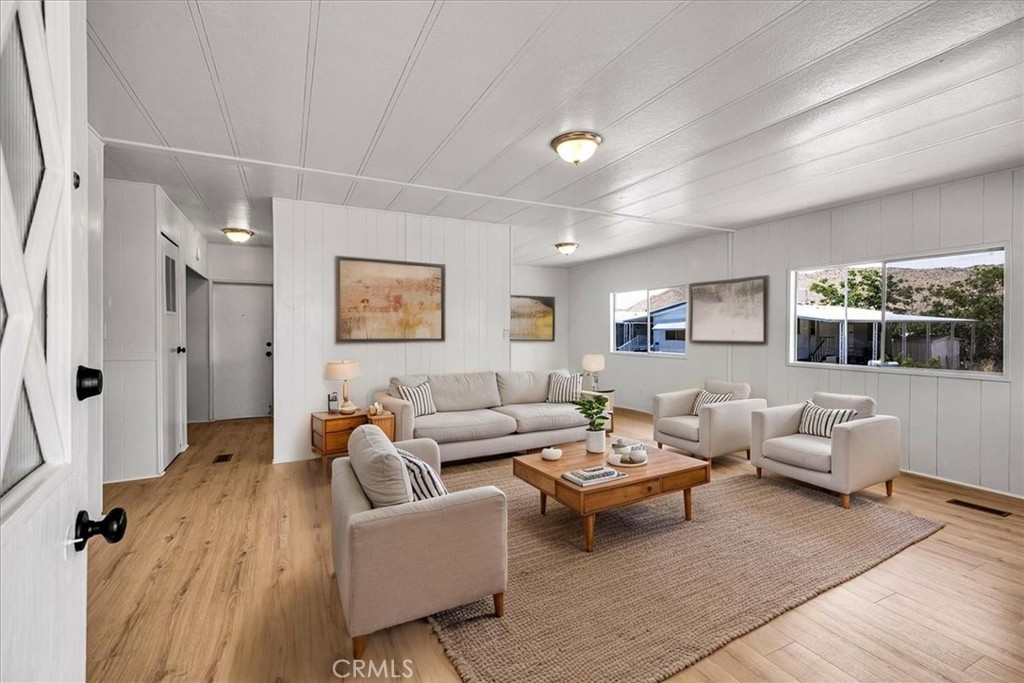 MOVE-IN READY – "Seller Willing To Sell On Payments" This beautifully updated manufactured home in Aztec Estates, a gated 55+ community in Yucca Valley, features brand new flooring, fresh interior paint, a fully updated kitchen with new cabinets and hardware, and updated bathrooms with modern finishes. The exterior has also been refreshed with updated siding and fixtures, enhancing the home’s curb appeal. Aztec Estates offers a peaceful, secure setting with monthly local events and social gatherings, creating a vibrant and connected lifestyle. Conveniently located just minutes from shopping, dining, medical services, and Joshua Tree National Park. Financing is available—don’t miss this turnkey opportunity in one of Yucca Valley’s most desirable 55+ communities. Some photos have been virtually staged.