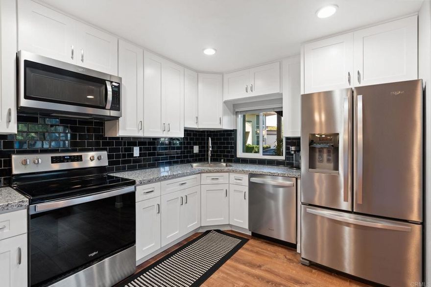 This completely remodeled 2 bedroom, 1 bath downstairs end-unit condo is located within a quiet, gated community in El Cajon and offers true move-in-ready living. The home has been thoughtfully updated from top to bottom. Highlights include new paint, LVP flooring throughout, new baseboards, lighting, newer HVAC system (2020), new dual pane windows, tankless hot water heater, brand-new front porch and a beautifully remodeled kitchen with new cabinetry, granite countertops and stainless steel appliances. The bathroom has also been upgraded with quartz countertops and modern finishes PLUS in Unit Full Size front load washer and dryer. Positioned in a great location within the complex, the unit sits well off the street, offering added privacy while still being close to community amenities. The gated community features assigned covered parking with storage, a pool, and racquetball courts that are being renovated currently. This is a highly upgraded home where all remodeling and improvements have already been completed, making it Move In Ready. If you’re looking for a turnkey condo in Central San Diego look no further.