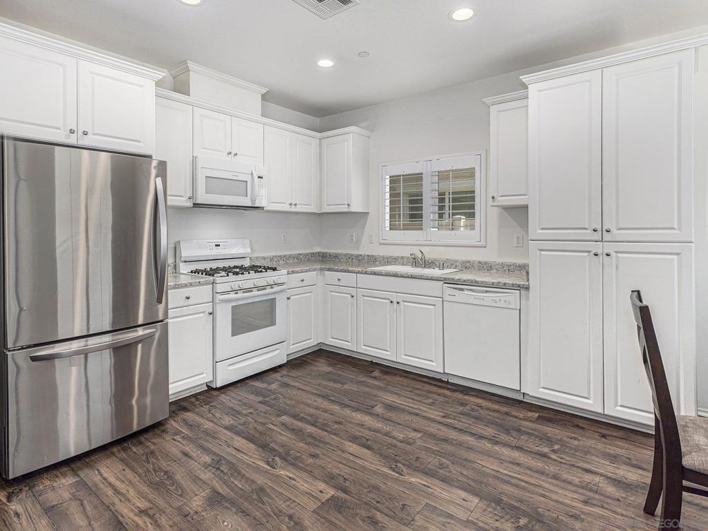 Nestled in the charming Horse Creek Ridge Community of Fallbrook, this casually elegant home blends comfort with style, offering 3 spacious bedrooms and 2.5 baths across 1,568 square feet of thoughtfully designed living space. Built in 2018, this detached home invites you in with its warm wood-look flooring and bright, airy ambiance, accentuated by plantation shutters and sleek white kitchen cabinets. This home isn't just a place to live—it's a place to thrive. Don't miss your chance to become a part of this vibrant community. VA and FHA Approved. Upstairs,find your sanctuary in the master suite,complemented by two additional bedrooms,a full bathroom,and a convenient laundry room. Enjoy the ease of an attached two-car garage with direct home access and relish the tranquility of your private backyard featuring a patio,low-maintenance artificial turf,durable vinyl fencing,whole house fan (for added efficiency and cooling) and paid off Solar. Home is furnished with Refrigerator, Washer and Dryer. Beyond the home,the Brindle Pointe and Horse Creek Ridge Community elevates your lifestyle with exceptional amenities. Dive into relaxation at the community pool,or enjoy fresh air and fun at the community park and play structures—perfect for both leisurely afternoons and lively gatherings.