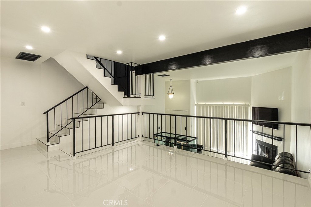 Nestled in the Chatsworth Community, this home is surrounded by beautiful lush greenery.
This Contemporary Tri-level townhome awaits. This contemporary sized home features a beautiful design! With fresh new paint throughout the home and the floors covered in White Armani Polished Porcelain, giving this home a gorgeous luxurious look.. Upon entry, you're greeted by high ceilings, a spacious living room with a cozy warm fireplace and an abundant amount of natural light that comes in from your private patio. In the middle level, you'll find the eat-in kitchen featuring ample counter space and cabinets, a breakfast bar and a charming bay window, which also includes the formal dining, which can double as an office and an inviting powder room. To accentuate their are two expansive primary suites, both complete with large walk-in closets and stylish bathrooms with dual sinks and beautifully tiled showers. In completing , this home boasts plenty of storage (including an enclave within the stairs!), a direct access two-car garage with laundry area and a community pool and spa. This quiet home is ideally located near dining, shopping and entertainment, you must see to appreciate, your new home awaits . . . .