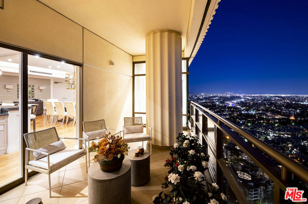 Live the luxe life in this stunning custom condominium located in The Century and featuring main balcony and living room views all the way to the ocean and South Bay, along with primary bedroom views of Beverly Hills, Hollywood, and beyond. Interior designer Victoria Montana has transformed the standard unit into a one-of-a-kind showplace with the addition of custom millwork, custom cabinetry, a floating ceiling in the main gathering space, and first-rate home automation subtle but effective redesigns that take this home to the next level, creating an optimally elegant home interior. Custom-designed kitchen features automotive lacquer cabinetry and high-end appliances including Miele and Sub-Zero plus large seated bar. In the primary suite, she has designed a custom vanity area/dressing room, dual en suite baths with onyx countertops and dual custom closets featuring walnut finishes and Swarovski lighting elements. Here you'll find a private dedicated balcony with views of the iconic Hollywood sign. Custom home automation system controls lights, draperies, blinds and can be altered for the owner's preference. Convenience features include in-unit laundry plus service elevator and entrance, wine storage and secure storage room for deliveries. The Century offers four acres of grounds and features extensive gardens designed by landscape architect Pamela Burton, along with a host of resort-style luxury amenities including gated security, concierge services, valet parking for residents and their guests, 75-ft pool and spa, upscale fitness studio, spa treatment room, screening room, and business center. Prime location offers easy access to Westfield Mall, Century City, Beverly Hills and Westwood.