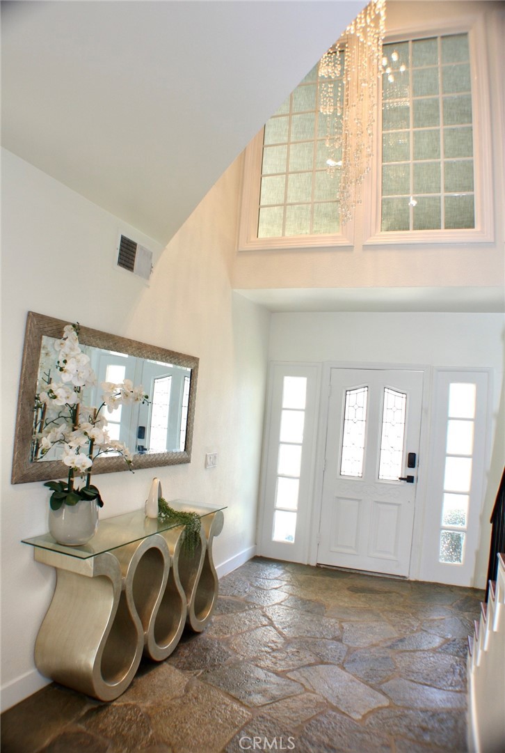 NESTLE IN SOUGHT IN TARZANA! THIS 2,900 SQ FT TWO STORY HAS 4 BEDROOMS AND 3 BATHS WITH VAULTED CEILINGS AND AN INVITING OPEN FLOOR PLAN. THE SPACIOUS FLOOR PLAN FEATURES A LARGE ENTRY, LARGE LIVING ROOM AND DINING AREA WITH FIRE PLACE, FORMAL FAMILY ROOM WITH WET BAR AND FIREPLACE, CHARMING BREAKFAST AREA WITH FRENCH DOORS THAT LEAD OUT TO A LOVELY BACK YARD. NEWLY REMODELED GOURMET KITCHEN WITH CENTER ISLAND, NEWLY UPGRADED STAINLESS STEEL APPLIANCES, GRANITE COUNTER TOPS, WINE FRIDGE AND CUSTOM CABINETRY. THE OVER SIZED MASTER SUITE HAS TALL CEILINGS, FIREPLACE, PRIVATE PATIO, SITTING AREA, WALK-IN AND WARDROBE CLOSETS. THE 3 OTHER GENEROUSLY SIZED BEDROOMS FEATURE LARGE CLOSETS, 2 OF WHICH ARE WALK-INS. THIS HOME INCLUDES AN AMPLE LAUNDRY ROOM UPSTAIRS, MIRRORED CLOSETS, CENTRAL VACUUM SYSTEM, ALARM SYSTEM, 2 CAR ATTACHED GARAGE, PRIVATE GRASSY REAR YARD SHADED BY MATURE TREES AND LANDSCAPING. THIS HOME HAS BEEN BEAUTIFULLY MAINTAINED WITH NEWER PAINT AND HARD WOOD FLOOR DUAL PANEL WINDOWS.