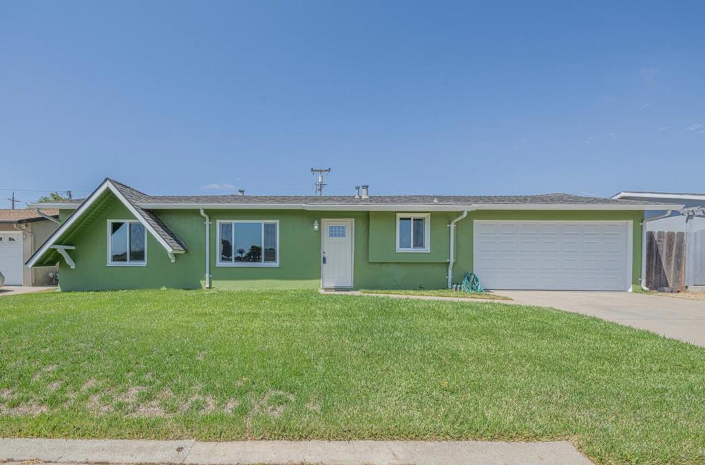 This charming residence has been fully updated, featuring three bedrooms and one and half bathrooms. The kitchen is a standout with modern amenities including granite countertops, soft self closing drawers, stainless appliances, and a pantry for added storage. New vinyl plank flooring has been installed throughout. Additional features include double pane windows for energy efficiency and a two-car garage. The bathrooms are updated and includes a shower over tub and dual flush toilets. With a nearly 7,000 square foot lot, this home provides ample space for outdoor activities. Don't miss the opportunity to make this delightful Salinas home yours!