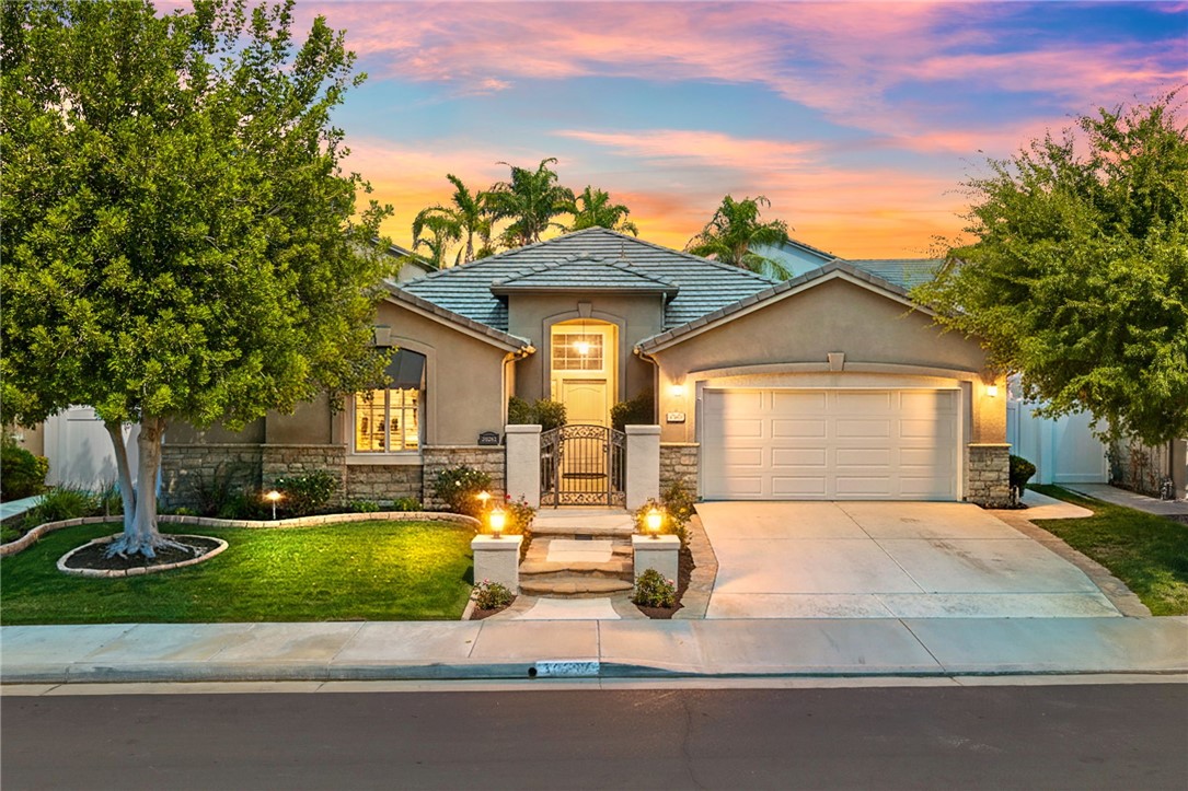 Welcome to Four Seasons, a premier 55+ resort-style community! This single-story home offers the community’s largest floorplan with 2,773 sq. ft., 3 bedrooms, an office, and 3 full bathrooms. High ceilings and wood-looking tile flooring enhance the open, elegant layout. The chef’s kitchen features granite counters, a large island with bar seating, stainless steel appliances including a Viking 6-burner cooktop, wall oven, convection oven/microwave, warming drawer, dishwasher, and a butler’s pantry with wine refrigerator. A separate formal dining room connects seamlessly to the butler’s pantry and kitchen. The kitchen also opens to the spacious family room with French doors to the backyard. The see-through fireplace warms both the family room and the living room, creating cozy yet stylish living spaces. Step outside to a large private backyard with fruit trees, a covered patio with ceiling fan, and plenty of space for entertaining or relaxing. Living in Four Seasons means resort-style amenities just steps from your door—recreation center, pool, spa, putting green, fitness center, pickleball and tennis courts, walking paths, BBQ area, plus a full calendar of social events and clubs. This home blends luxury, comfort, and community living at its finest!