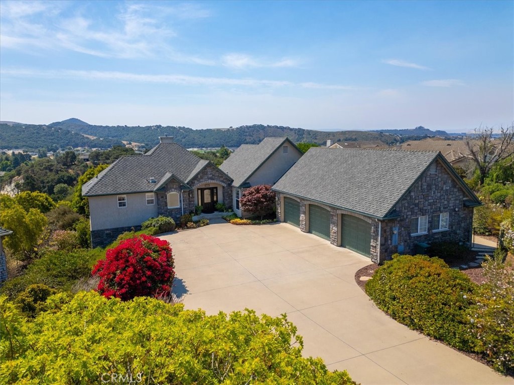 Prestigious Canyon Crest Home with Panoramic Views
Tucked away on a peaceful cul-de-sac near the Village of Arroyo Grande, this stunning home is just blocks from Historic Downtown and minutes to the ocean and world-class wineries.
From the moment you step inside, the mountain and hillside views will captivate you. The inviting entry and living room feature rich wood floors, a cozy fireplace, and a spacious master suite. The kitchen is a chef’s delight with stainless steel appliances, granite countertops, and travertine floors. A formal dining room offers plenty of space for family gatherings, while the family room—with built-in entertainment center—opens to a view deck perfect for morning coffee.
The backyard is your private park, with fruit trees, berry bushes and complete with panoramic vistas, lush garden spaces, and multiple seating areas to relax and watch the birds. A large deck makes entertaining a breeze.
Additional highlights include a roomy 3-car garage with abundant storage.
This gorgeous Canyon Crest home offers the perfect blend of privacy, elegance, and location. Schedule your showing—homes like this don’t last long.