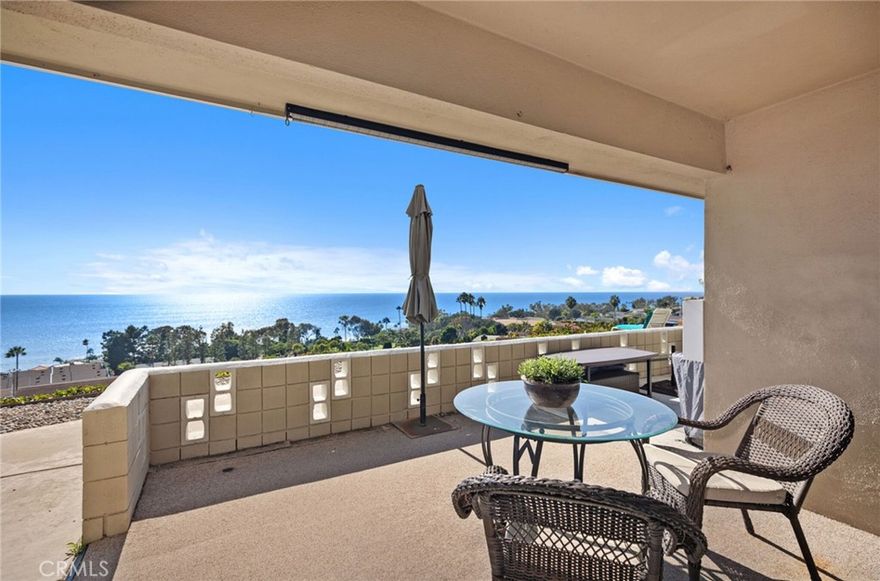 Prepare to be mesmerized by sit-down panoramic ocean and whitewater views overlooking Aliso Creek Beach, Montage Resort, Treasure Island and Frederick Lang Parks, including sceneries of beachgoers, surfers, stand-up paddle boarders, sailboats, and beach sand! This single level, 2BD/1BA ground floor condo has a private garage, storage, view patio, and wide blufftop walkway! Watch the captivating Catalina Island sunsets, the moon highlighting the shimmering ocean, twinkling lights, and picturesque hillsides. Bring your binoculars and you might see whales and dolphins just yards beyond the shoreline! Gather fresh herbs from the garden and dine al fresco enjoying the gentle ocean breeze. Step inside to find a seamless blend of light and bright, indoor-outdoor living with an open concept floor plan, featuring an updated and well-organized kitchen: polished and sleek Cambria Quartz countertop and breakfast bar, Seastone Medallion tile backsplash, upgraded stainless steel appliances (Fisher & Paykel oven, G.E. Profile, and Frigidaire), stylish range hood, custom cabinetry with glass enclosures displaying your favorite serve ware, wine rack, and more! New LR carpet. The Seller contributed to the new roof! The floor plan is larger than some of the other 2BD/1BA in the community. Have a dog? The spacious, primary bedroom features its own enclosed private back patio entry. The secondary bedroom, with a deep closet is large enough for housemates, home office, or gym. The large bathroom features dual sink vanities, shower-in-tub combination with bench, and glass enclosure. Savor the serene, relaxing feeling of a beach resort! A solar-heated swimming pool, lounge chairs, cabana, and BBQ area, all with ocean view, make for a priceless, luxuriating experience! Enjoy the simple life with a convenient lifestyle at a gem of a beach town. Take a short stroll, within minutes to 5-star, 5-diamond world class Montage Resort with its signature restaurants, Treasure Island Park, coves, white sand beaches, and scenic walking trails. Just down the walkable street, are top choices for your palate: La Sirena Grill, Starfish, O, Golden Spoon, Drake. The Ranch’s 9-hole golf course and Harvest Restaurant, downtown Laguna Beach art galleries, shops, restaurants, art festivals, and Laguna Playhouse are within minutes by car or trolley. Make this your vacation getaway, primary home, or investment property. Inquire about rental comps. Short 1031 exchanges considered. Schedule a visit today!