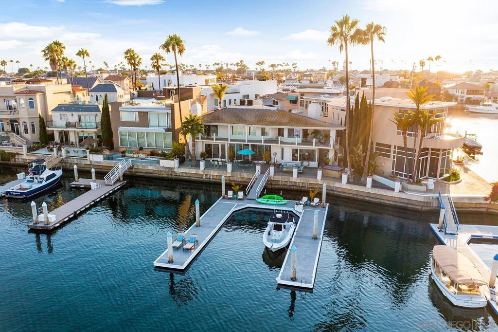 Spectacular custom home with 100+ feet of expansive bay views accommodates up to 95 ft yacht with double boat docks. Rare opportunity to acquire this entertainer's dream house private patio with hot tub, multiple indoor and outdoor seating options, along with gourmet kitchen and large dining room with stunning glass-enclosed wine cellar. This masterpiece has been elegantly remodeled with high end finishes including custom cabinetry, Wolf kitchen appliances, Kohler bath fixtures, Sonos speaker systems, designer lighting, master bedroom steam/shower, & meticulous attention to detail throughout. Soak in the endless views across the bay from the 64 feet of balconies accessed from the Master and Guest suites. Complex Features: ,,, Equipment: Dryer, Washer Sewer: Sewer Connected Topography: LL Frontage: Bay