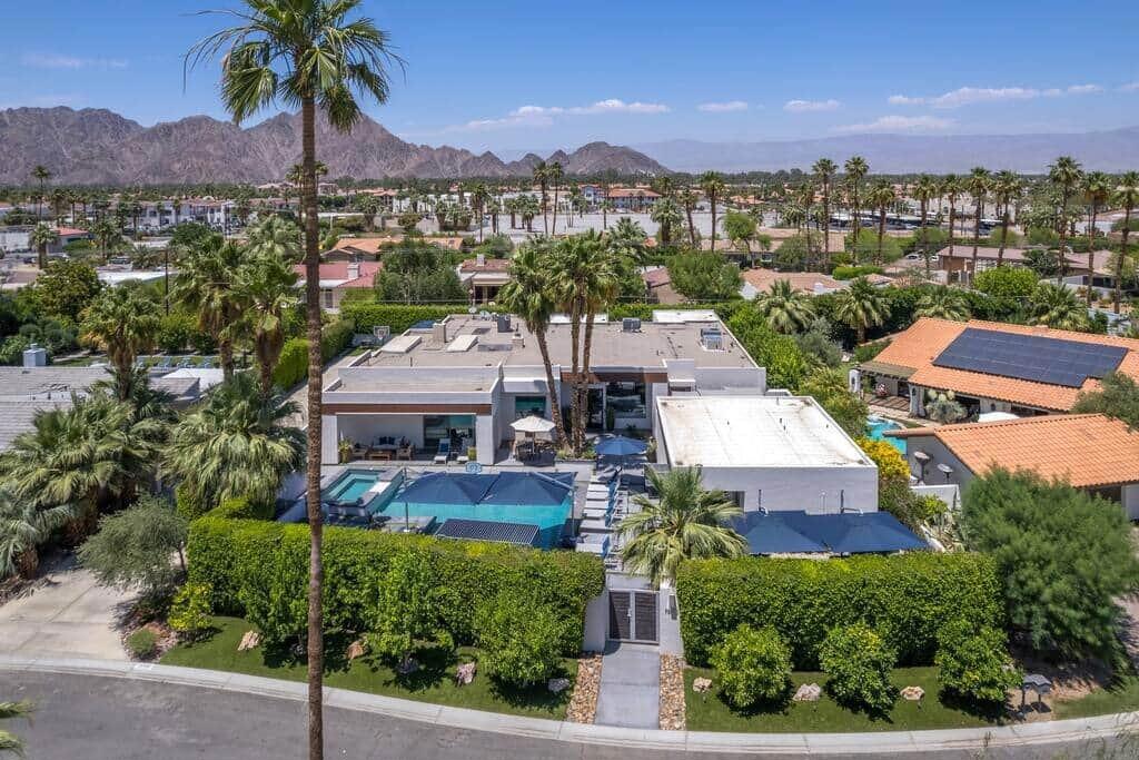 LOCATION, LOCATION, LOCATION!!! Nestled on one of the most Beautiful Streets in all of La Quinta, within a 2-3 minute walk to Quaint and Lovely Old Town La Quinta. Enjoy fine dining and boutique shopping right out your door from this Private, Gated and Modern Estate. This home was recently completely redesigned and rebuilt, creating a wonderful place to call home and to entertain family and friends. Golf, Bicycling, Walking, Hiking, Pickle Ball, Tennis, and Fitness Center are all within minutes. Top quality construction and appointments make up this beautiful home. The gourmet kitchen will satisfy the most discriminating of chefs with; double spacious islands, double ovens, double drawer microwaves, double dishwashers, loads of cabinets and drawers, 5 burner induction cooktop, warming drawer, pot filler, and spacious coffee bar. All bedrooms are en-suite, terrific open floor plan with high ceilings and large windows. You will come to relax and not want to ever leave!