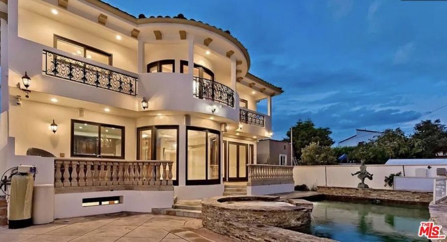 Tour now, Move in November!Located on one of the most coveted streets in prime Beverly Hills, this gated and private Italian Villa offers approximately 6,000 square feet of luxurious living space. Featuring 6 bedrooms and 7.5 bathrooms, the home showcases exquisite craftsmanship, including marble floors, intricate moldings, custom built-ins, and 8-foot carved mahogany doors. Designed for both comfort and entertaining, the open floor plan includes a formal living room with fireplace that flows seamlessly into the dining area and spacious family room. The gourmet chef's kitchen is equipped with granite countertops, a large center island, extensive cabinetry, top-of-the-line appliances, and a charming breakfast room. A grand marble staircase leads to the second floor, which features four en-suite family bedrooms and a lavish primary suite complete with a private balcony, fireplace sitting area, and a luxurious marble bathroom. An additional bedroom/office is located on the main level. The one-of-a-kind, open-concept basement, accessible via a private rear entrance, offers a state-of-the-art home theater, game room, guest bedroom or gym with bathroom, laundry room, and maid's quarters. Outdoor amenities include a patio with built-in BBQ, gated parking via alley access, and a solar-heated poolperfect for enjoying the California lifestyle.