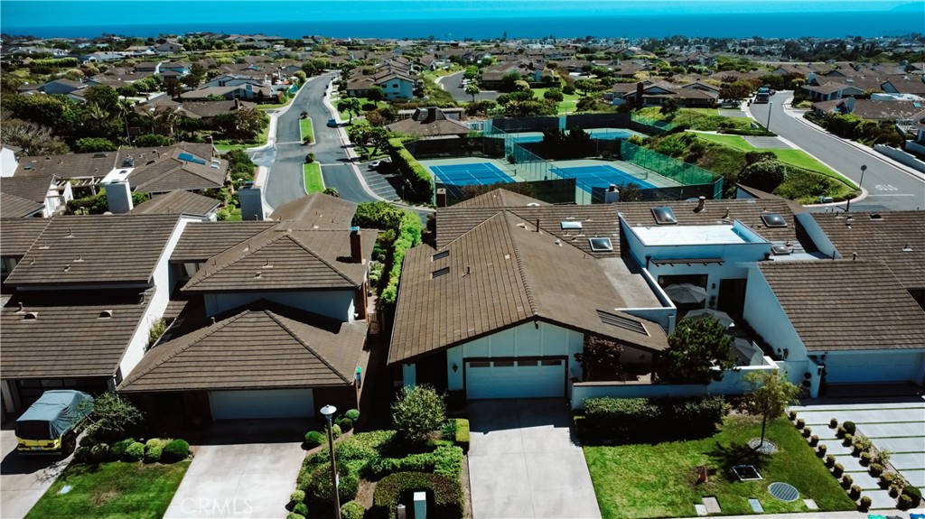Perched at the highest point of one of Corona del Mar’s most prestigious gated communities, 34 Mainsail Drive presents a rare opportunity to reimagine a view property in an extraordinary setting.
Set on a private terrace that commands sweeping views of the entire neighborhood, greenbelts, clubhouse, sports courts, the coastline of Corona del Mar, and the shimmering Pacific beyond, this original residence offers endless potential for luxury buyers, developers, or investors. From sunrise to sunset, the panoramic vistas—framed by Catalina Island on the horizon—set the stage for an unrivaled coastal lifestyle.
The home itself is a true fixer, offering a blank canvas for customization or complete redevelopment. Whether you envision a refined modern masterpiece, a classic California coastal retreat, or a legacy property to hold and transform over time, the elevated site and ocean-facing orientation ensure that any vision will be richly rewarded.
Located just minutes from world-class beaches, top-rated schools, upscale shopping, and the vibrant heart of the Village, 34 Mainsail Drive is more than a property—it’s a vantage point for the best of Southern California living. Opportunities in locations like this are few and far between—and they never last.