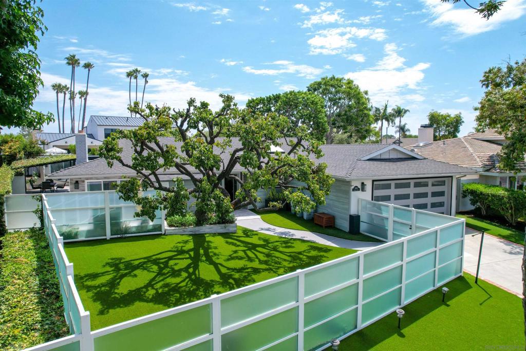 Situated in one of Newport Beach’s most coveted neighborhoods, 1806 Leeward Lane offers the rare chance to enjoy single-level living in the highly desirable Baycrest community. This transitional ranch-style residence features 3 bedrooms and 2 bathrooms across a thoughtfully designed floor plan, with airy living spaces that emphasize natural light, openness, and a true connection between indoors and out. A striking iron front door opens to a spacious living area anchored by a custom limestone fireplace wall, creating both warmth and architectural appeal. Walls of sliding glass doors extend the living spaces outdoors, while the remodeled kitchen seamlessly connects to the dining area, opening directly to the expansive backyard. The property’s fully fenced and gated lot provides total privacy, offering a serene environment to create your own retreat. With ample space for a pool, outdoor kitchen, or garden, the possibilities for entertaining and relaxation are endless. Additional features include a recently serviced AC system with a smart new Nest HVAC thermostat for modern comfort and efficiency. Perfectly located, the home is just minutes from the lagoons of the Back Bay, the sandy beaches of Newport, the Newport Aquatic Center, Mariners Park, and the dining and boutique shopping along 17th Street. Families will value the award-winning Mariners Elementary School District, while commuters will appreciate the proximity to freeways and neighboring coastal communities. Invest your future in this Baycrest location and a neighborhood ripe with new investment and opportunity!