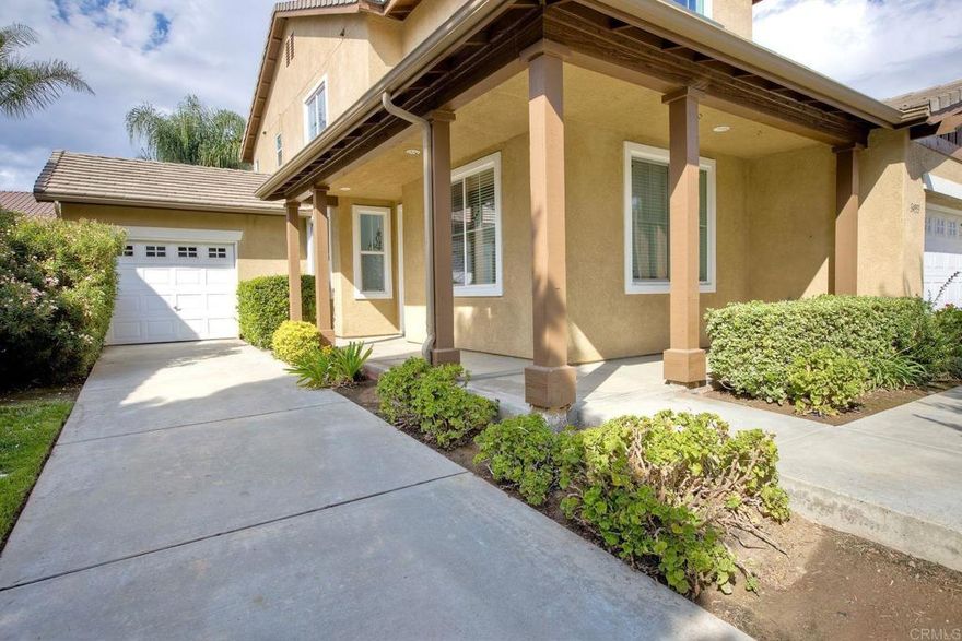 Nestled in a quiet, family-friendly Winchester neighborhood, this inviting two-story home offers a smart layout and comfortable living on a manageable lot. Built in 2003, this residence features approximately 2,334 sq ft, with 4 bedrooms and 3 bathrooms — including a convenient first-floor bedroom and full bath for guests or multi-generational living.   Step inside to discover a bright entry and open-concept floor plan. The kitchen is well-integrated into the living spaces, allowing effortless entertaining between the kitchen, adjacent dining area, and family room. Cozy up by the fireplace in the family room, which is pre-wired for surround sound, or use the space as a media/lounge retreat.   All bedrooms are upstairs (except the one on the main floor), providing separation and privacy. The primary suite is roomy and well-appointed, with an en-suite bath and ample closet space. The additional upstairs bedrooms share full bathroom access.  Outside, the yard balances hardscape and potential for green landscaping, with a covered patio that invites al fresco dining or lounging. The lot is approximately 6,534 sq ft, providing room for gardening, play areas, or future outdoor enhancements.   Parking is generous: a 3-car split garage plus a long driveway ensures ample space for multiple vehicles and guests.   The home is ideally located within reach of schools, shopping, Eos Fitness, as well as the newest Cotsco, local dining in French Valley off Benton and Winchester Rd. and easy freeway access. Abelia Sport Park is within walking distance.