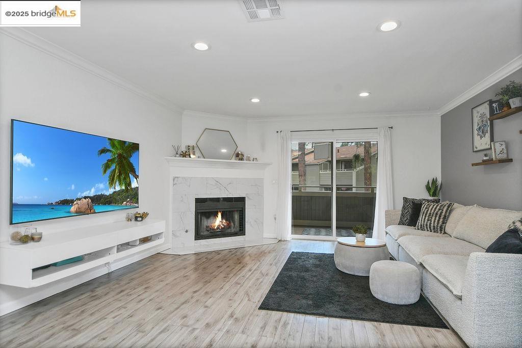 Welcome to easy living in this beautifully updated 2-bedroom, 1.5-bath condo nestled in the serene, tree-filled Eastgate community in Martinez. With no neighbors above or below, enjoy the peace and privacy of a single-family feel in a low-maintenance condo setting. Inside, you'll find a bright & inviting space featuring recessed lighting, crown molding, laminate flooring, indoor laundry & an updated kitchen with sleek countertops, stainless steel appliances & decorative backsplash. Stay comfortable year-round with a brand NEW HVAC system & enjoy the added bonus of a rare, large private storage area beneath the home - ideal for extra gear, tools, or seasonal decor. Enjoy not one, but two private balconies, both with extra storage & views overlooking the beautiful common area pathways, perfect for morning coffee or evening unwinding. Additional perks include a sparkling pool, designated carport parking space plus an extra assigned spot, visitor parking and the HOA also covers your sewer, water, garbage, exterior maintenance & more! With quick highway access, your commute or weekend getaways are easier than ever. Whether you're relaxing at home, entertaining guests or heading out for your next adventure, this condo offers a lifestyle of comfort, convenience, & charm. DON'T MISS OUT!