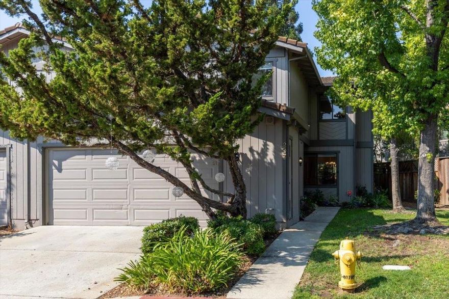 Stylish corner unit townhome in the desirable Courtstyle community of Los Gatos with access to top rated Los Gatos schools. The main level features hardwood floors, fresh paint, recessed lighting, a spacious living area with a cozy gas fireplace, and a formal dining area. The remodeled kitchen is finished with crisp white Shaker cabinetry, quartz counters, stainless appliances, and abundant storage including a large pantry, all overlooking the backyard. Upstairs, the vaulted primary retreat offers a private balcony, gas fireplace, and a spa inspired bathroom with double sinks, skylight, oversized tile shower, and walk in closet. Additional highlights include updated secondary bathrooms with modern finishes, convenient interior laundry, double pane windows, new carpet upstairs, and a two car attached garage. The rear yard offers generous patio space with café lights, creating a private outdoor setting for entertaining or gardening. Turnkey living in a prime neighborhood and truly a must see.