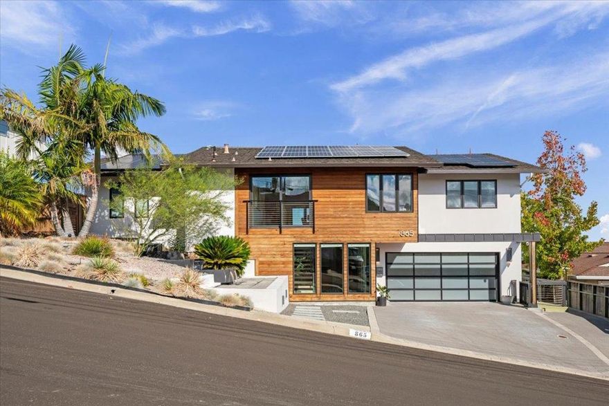 Extensively remodeled and expansive bay views in the hills of San Carlos! Bifold doors in the living room lead out to the rear deck, creating a true indoor/outdoor experience. The kitchen is well appointed with stainless steel appliances and granite countertops. The primary bedroom offers soaring ceilings with skylights and a spacious closet with built-ins. The primary bathroom includes dual sinks, a large shower, and separate tub. The rear deck presents a great space for entertainment with a gas fire pit and hot tub. An additional space located on the first floor is available for your enjoyment. Located on a cul-de-sac, this home is just minutes from Downtown San Carlos, CalTrain, sought after schools, access to 280, and all of the open space trails and parks the area has to offer. Owned solar panels.