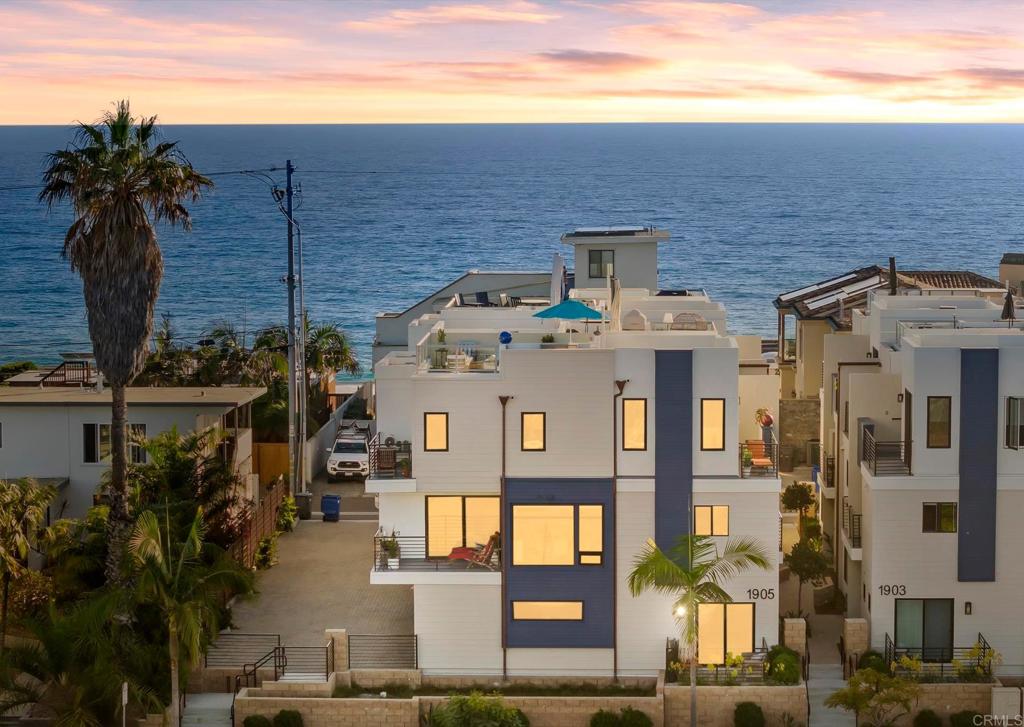 Fabulous newer coastal home with ocean views, just one blocks from the Pacific and located in the vibrant “South O” neighborhood. Located between Cassidy Street Beach and St. Malo Beach, this 3 bedroom, 4 bathroom beach townhome features a private ocean view roof deck, attached 2-car garage, tankless water heater, and open concept living/dining/kitchen that's ideal for entertaining with a patio/deck off of every room and lots of natural light. Enjoy ocean breezes, spectacular sunsets, and a beautiful, walkable community. A pristine, move in ready townhome that's 95 feet above sea level, WEST of I-5, WEST of the S. Coast Highway, and WEST of the train tracks just blocks to “South O” shops and restaurants. Your new beach life awaits.