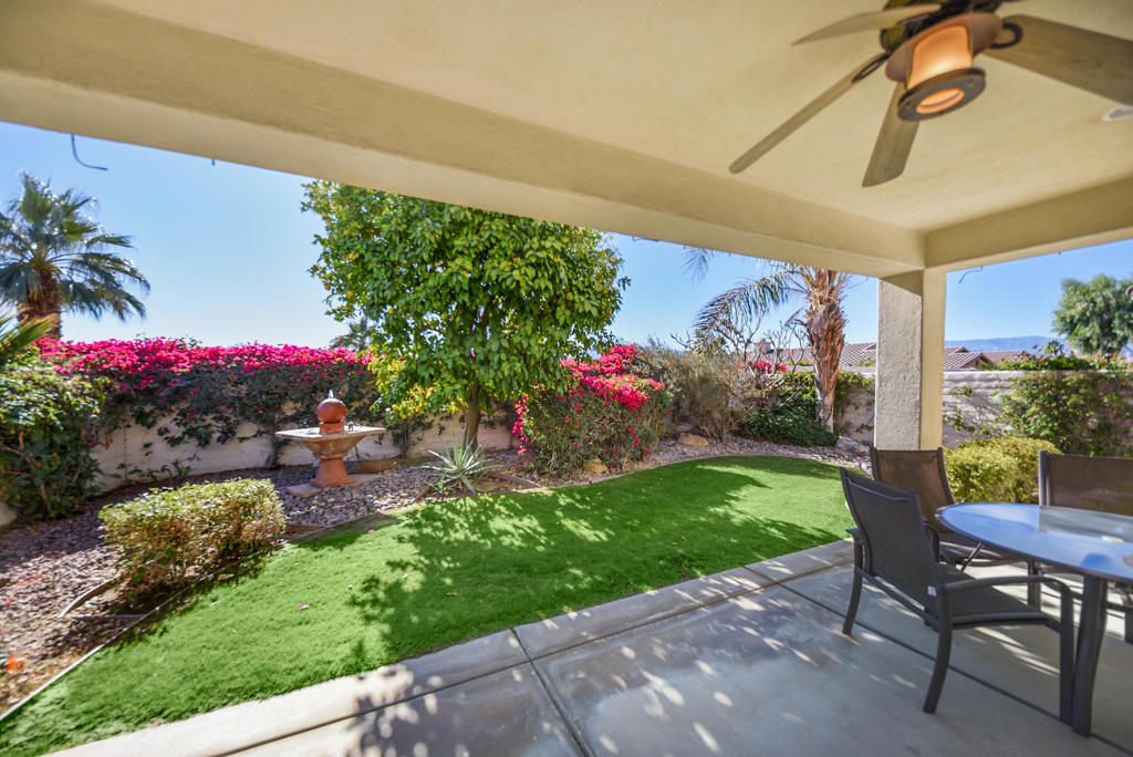 Discover easy desert living in this San Ysidro floor plan offering 1,463 sq ft (EST.) of well-designed space. Built in 2004, it features tile flooring in the great room, den, bathrooms, kitchen, and hallways for elegance and low maintenance. On a desirable south-facing lot, you'll enjoy abundant natural light and serene backyard views with plush grass. This house is ideal for relaxing or entertaining. The open layout flows seamlessly with a well-equipped kitchen, a cozy living area, and a dining space perfect for gatherings. In the sought-after Sun City Shadow Hills community, you'll access premier amenities including golf courses, pools, fitness centers, and a vibrant social scene. Don't miss out on the opportunity to make 80323 Avenida Linda Vista your home sweet home.