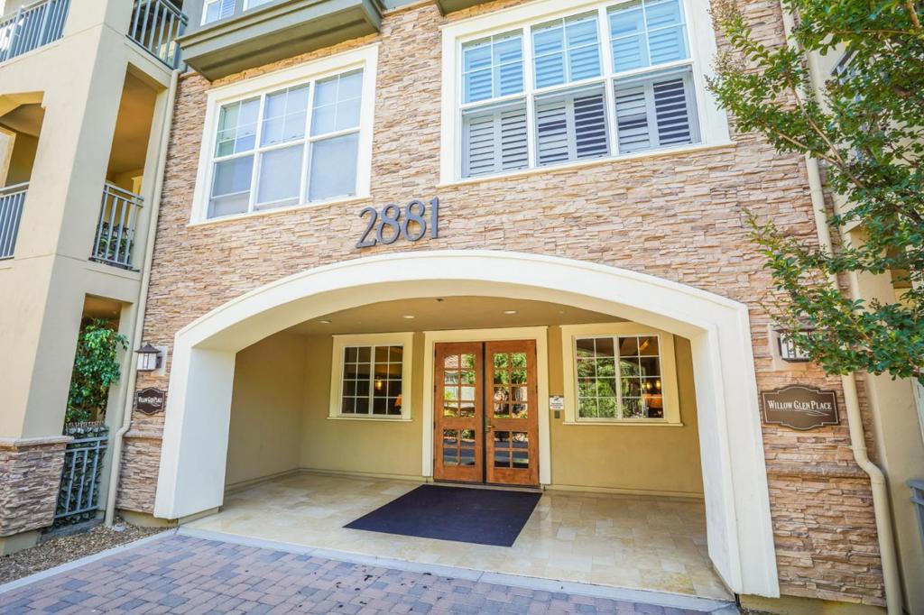 Ideally located in the Willow Glen Place community is this remarkably spacious & sophisticated Fairwood model condo. Walk through manicured grounds to the secure lobby/elevator. Upon entering, you're greeted by a charming kitchen fitted with granite countertops & a full suite of stainless-steel appliances. Light pours in from the connected living room, where double doors open to a balcony. Upgraded flooring and LED lighting complement over 30k worth of custom, built-in cabinetry as an entertainment center, fireplace & wine bar further elevate the space. Follow the hall past a full bath & laundry closet to the bedrooms. In the primary suite, you'll find a luxurious ensuite, and both bedrooms offer walk-in closets. A gorgeous home is not the only enjoyment in this amenity-filled community; there's access to a pool, clubhouse, playground, gym, 2 secure parking spots, and additional storage. The convenient location is surrounded by endless eateries, shopping, and major roads/freeways.