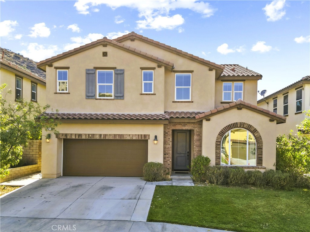 28217 Nield Ct, Santa Clarita, CA 91350 – This stunning 4 bedroom, 4 bathroom home spans 3,466 square feet and sits on a 5,014 sq ft lot tucked away on a peaceful cul-de-sac in one of the area’s most sought-after neighborhoods with no Mello Roos and a low HOA. Step inside to find a spacious and thoughtfully designed layout, ideal for modern family living. The main level features a large open floor plan with an expansive kitchen at its heart—complete with a generous center island, walk-in pantry, and seamless flow into the family room and dining area, making it the perfect space for entertaining. A flexible den or office on the first floor can easily be converted into an additional bedroom. One of the standout features is the private Next Gen suite on the main level, which includes its own living room, bedroom, walk-in closet, kitchenette, and space for a stackable washer and dryer—ideal for extended family or guests. Upstairs, a roomy loft offers extra living space along with three additional large bedrooms. The luxurious primary suite serves as a true retreat, featuring a spacious ensuite bathroom. Enjoy indoor-outdoor living with oversized sliding doors that open to a cozy California room with a built-in fireplace, perfect for relaxing year-round. The backyard is designed for low maintenance, giving you more time to enjoy your home and less time on upkeep. Located near parks, schools, and amenities, this home offers the perfect blend of comfort, flexibility, and community living.