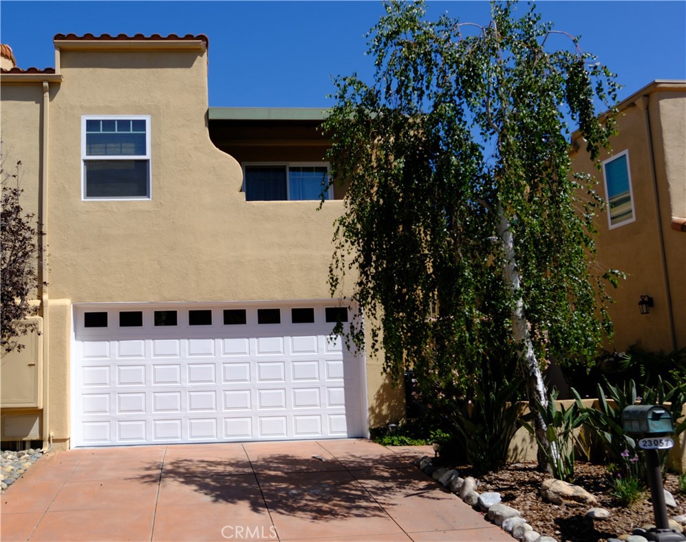 **Elegant Creekside Calabasas Townhome**
Nestled in the highly sought-after Creekside Calabasas community, this spacious townhome offers style, comfort, and an unbeatable location. Recently painted and upgraded with beautiful wood flooring throughout, brand-new windows, and doors, the home is move-in ready.
The light-filled living room boasts soaring cathedral ceilings, a cozy fireplace, and a built-in media niche. The chef’s kitchen features all-new cabinetry, a double oven, stovetop, dishwasher, walk-in pantry, and breakfast bar — seamlessly flowing into the inviting family room with a second media niche. For special occasions, enjoy the separate formal dining room.
Retreat to the expansive primary suite with a private balcony, a relaxing sitting area, and a spa-like bath complete with a soaking tub, separate vanities, and generous natural light from overhead skylights. The second bathroom also enjoys a skylight, creating a bright, airy feel.
Moving outside to a lush backyard with a covered patio, perfect for entertaining or unwinding. All this within the acclaimed Las Virgenes School District, and just moments from Lake Calabasas, The Commons, shopping, dining, and easy access to the 101 freeway.