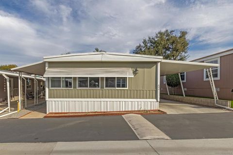 Photo of 1351 PEPPER DR Dr #62, El Cajon, CA 92021 (MLS # 250045070SD)