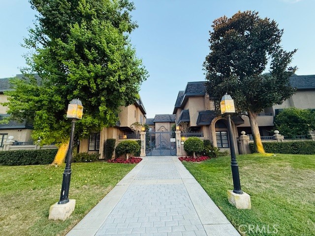 Discover timeless elegance in this beautifully maintained French Normandy-style townhome, ideally situated in one of Arcadia’s most desirable gated communities. Beautifully updated 2 bed, 2.5 bath townhome with 1,789 sq ft of bright, open living space. Features include high ceilings, crown moldings, newer flooring, interior paint, and recessed lighting. The spacious living room offers a fireplace, wet bar, and access to a huge private patio-perfect for indoor-outdoor entertaining with 8-ft-tall garden shelves filled with plants and a fully installed automatic misting irrigation system. . The large kitchen includes a sunny dining area and brand-new dishwasher. Upstairs, enjoy a generous primary suite with fireplace, retreat, walk-in closet, and balcony with new wood decking. Convenient upstairs laundry, 2 subterranean parking spaces, and bonus storage room. Washer, dryer, and custom curtains included. Gated, well-maintained complex with HOA covering water/ trash/insurance. Prime location near shops, dining, and award-winning schools.