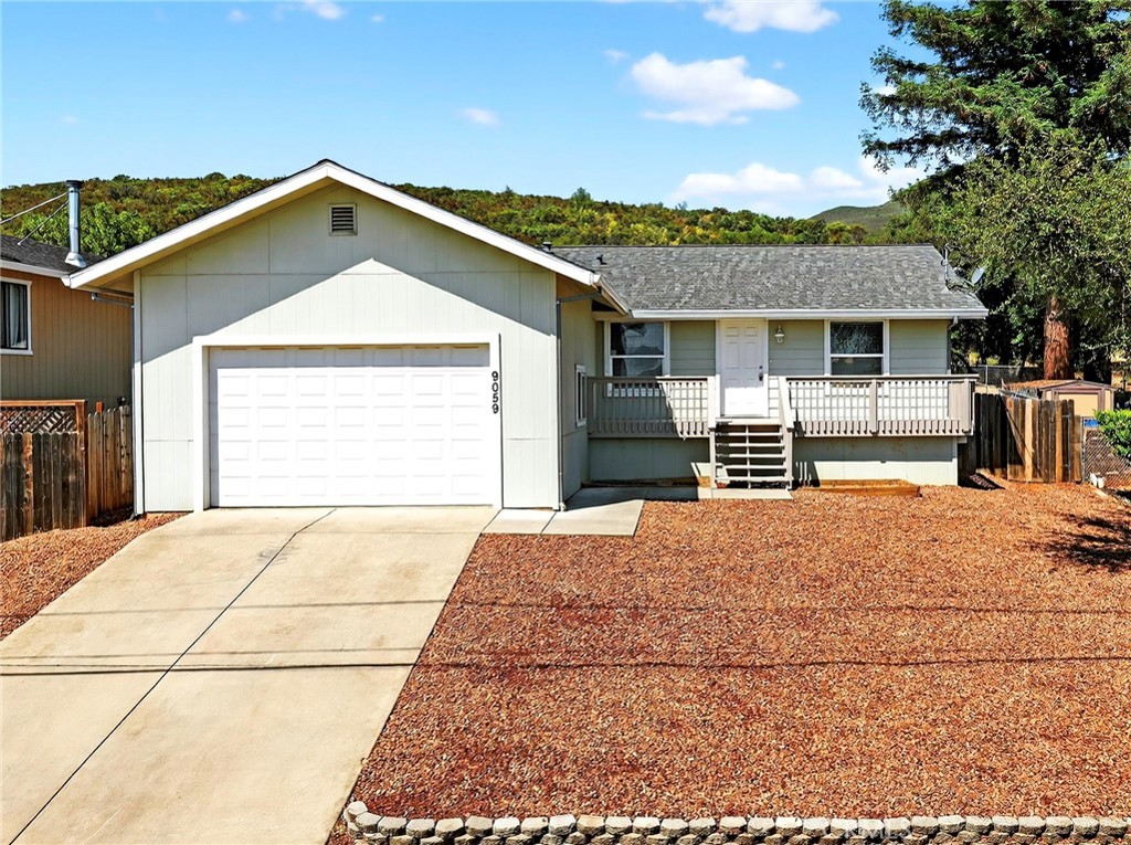 Step into this beautifully maintained, move-in-ready home, 2 bedroom, plus den, 2 bath, 2 car garage. Enjoy a great room with living area, dining area and full kitchen; primary bedroom and bath, guest room, guest bath, versatile den, and convenient laundry room. The fenced backyard opens to open land, while the front deck offers a peek-a-boo lakeview and low-maintenance yard. Recent updates include a roof, deck, fresh paint, and flooring—ensuring comfort and peace of mind. Welcome home!