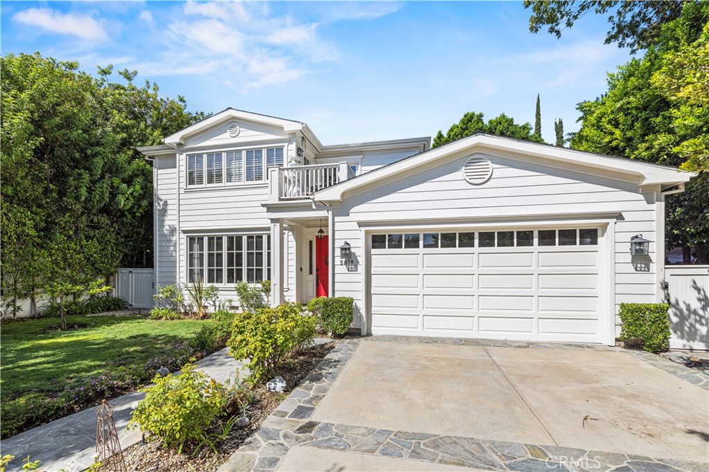 This Ken Unger–designed traditional residence blends timeless character with modern sophistication. Offering 5 bedrooms, 6 baths, and over 5,200 square feet of living space, the home showcases wide-plank wood floors, detailed moldings, and a dramatic central staircase. A grand formal living room with fireplace and an elegant dining room set the stage for entertaining, while the chef’s kitchen features a marble-topped island, custom cabinetry, butler’s pantry, and top-tier Viking and Sub-Zero appliances.
The main level also includes a private office/library, convenient mudroom with laundry, and a guest suite with its own bath. Upstairs, four additional bedroom suites include a spacious primary retreat with a sitting area, home office, dressing space, luxurious walk-in closet, spa-inspired bath with oversized jetted tub, and a dual-head glass shower.
Outdoors, the private yard invites year-round enjoyment with a built-in BBQ bar, covered patio, and custom saltwater pool, all framed by mature landscaping. Located on a peaceful, tree-lined street just steps from Ventura Boulevard and within the sought-after Hesby Oaks school district, this property offers both elegance and everyday comfort.
