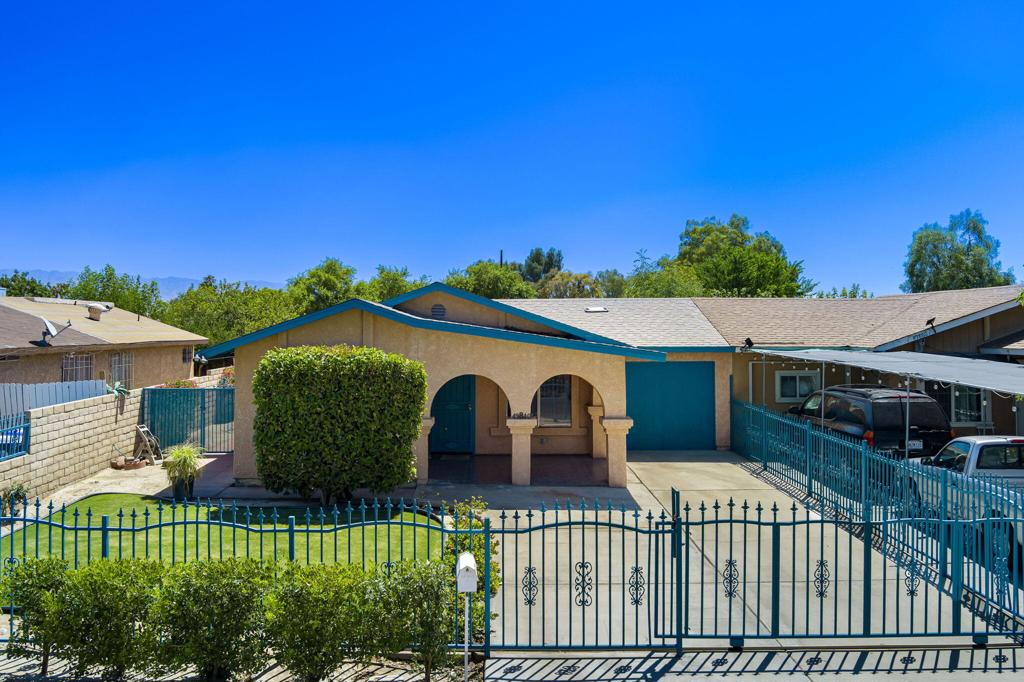 Welcome to this well-maintained and spacious 3-bedroom, 1-bath home offering comfort, space, and privacy in the heart of Coachella. The layout includes a bright living and dining room combo, a separate family room, and an individual indoor laundry room for everyday convenience. Step into the beautiful, updated kitchen with stainless steel appliances perfect for preparing meals for loved ones. Enjoy an enclosed front yard that adds charm and security, plus a private backyard perfect for relaxing or entertaining. The gated driveway provides additional peace of mind. Stay cool year-round with central air conditioning, plus a wall AC unit and an evaporative cooler--both located in the family room. The central A/C was replaced in October 2020, offering energy-efficient comfort. Other recent updates include a new roof installed in August 2022 and a new back fence added in April 2025. Located in a prime spot near shopping centers, restaurants, schools, and local parks, this home offers the convenience of everyday essentials just minutes away. With easy access to major roads, commuting and daily errands are effortless. No HOAS and the electricity provider is IID.
