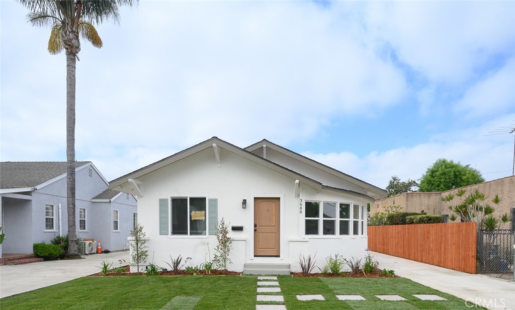 Beautifully UPDATED 3 bedroom, 1 bath home in the heart of Lynwood with ADU possibilities. The kitchen has new custom two tone cabinets, new counter tops, tile backsplash, all new stylish fixtures and stainless steel appliances. The bathroom has new double sink vanity, custom tile work and new fixtures. Other upgrades include luxury flooring, freshly painted interior and exterior, new plumbing and lighting fixtures, ceiling fans in the living room and all bedrooms, new energy efficient windows, upgraded electrical panel, central heat and air conditioning and indoor laundry. This home features a newly landscaped front yard and private enclosed back yard perfect for fun and entertainment. There is one car detached garage and driveway offering off street parking. Conveniently located to schools, freeways, shopping centers, and parks. Tax rolls show different bed count. Buyer to verify all building codes and ADU guidelines with the city.