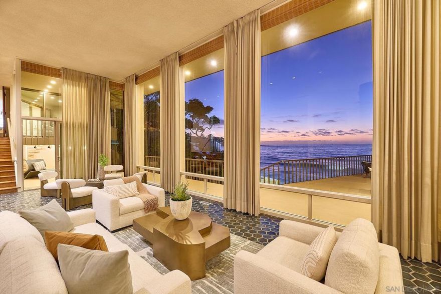 A rare oceanfront opportunity, this mid-century architectural jewel by Russell Forester sits in one of the most coveted locations of La Jolla Shores, just steps from the world-renowned Marine Room. Designed with dramatic walls of glass framing endless Pacific vistas, the home features a floating dining room above the shoreline and nearly every room opening to unforgettable views. Indoor-outdoor living is effortless, with a private pool, ocean-view loggia, and a stunning glass cabana blending seamlessly into the coastal setting. Impeccably preserved with timeless design, the residence is ready to enjoy as-is or to reimagine into a modern masterpiece. From luminous sunsets to kayakers drifting by, this is an irreplaceable coastal gem and a true once-in-a-lifetime offering.