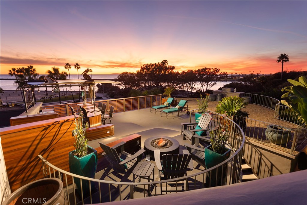 COMPLETELY FURNISHED - OCEANFRONT MANSION WITH BREATHTAKING VIEWS FROM EVERY ROOM! Experience unparalleled sophistication and exceptional craftsmanship in this stunning gated custom estate, offering sweeping 180-degree views of the Pacific Ocean and Newport Bay. Seamlessly blending indoor and outdoor living, the estate features expansive patios, sun-drenched decks, a rooftop entertainment area, and a main-level terrace—each providing unobstructed ocean and bay vistas, along with two hidden gardens. The open-concept main level showcases floor-to-ceiling windows, a grand great room, a chef’s kitchen with Wolf/Sub-Zero appliances, and custom fireplaces. The luxurious primary retreat includes a sitting area, walk-in closet, and a spa-like bath with a steam shower, infrared sauna, and newly updated double vanities. The lower level offers two spacious ensuite bedrooms and a private guest casita with separate access. The entrance level features a private gate leading to the rooftop deck with a built-in bar, two fire pits, a guest bath, and a 2-car garage with additional parking for 4 vehicles. Whether watching yachts on Newport Beach Jetty, spotting dolphins in the Pacific, or enjoying sunsets over Catalina Island, every room boasts access to private patios with breathtaking water views. Ideally located near the beach, Corona del Mar village, and world-class shopping at Fashion Island and South Coast Plaza, this estate is pet-restricted with exceptions under state and federal law and can be leased furnished or unfurnished.