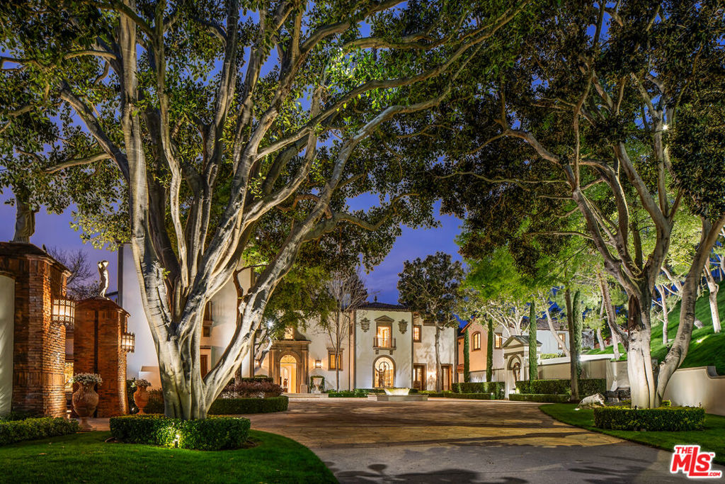 This World-Class Celebrity Contemporary Mediterranean Compound is poised on a sprawling apx. 3.5 acre site in the exclusive guard-gated enclave of North Beverly Park. Situated behind private gates at the end of a cul-de-sac & up a long driveway, this property is a world unto itself. Enter onto the large motorcourt & be transported to the Italian Riviera. This estate provides an exceptional lifestyle & panoramic city & canyon views from every room. Exquisite 2-story foyer, formal living & dining rms, family rm, office & massive kitchen. Screening room, gym, cigar rm & incredible custom bar. 6 bdrms & 9 bths in the main house including the gorgeous master suite w/dual baths, sauna, steam room & office with terrace. The 2-story Richard Landry designed guesthouse is its own residence w/living & dining rms, kitchen & 2 bdrm suites. The spectacular grounds offer an extraordinary resort-style setting w/sprawling lawns, patios, putting green & infinity pool & spa. 8-car garage & art studio.