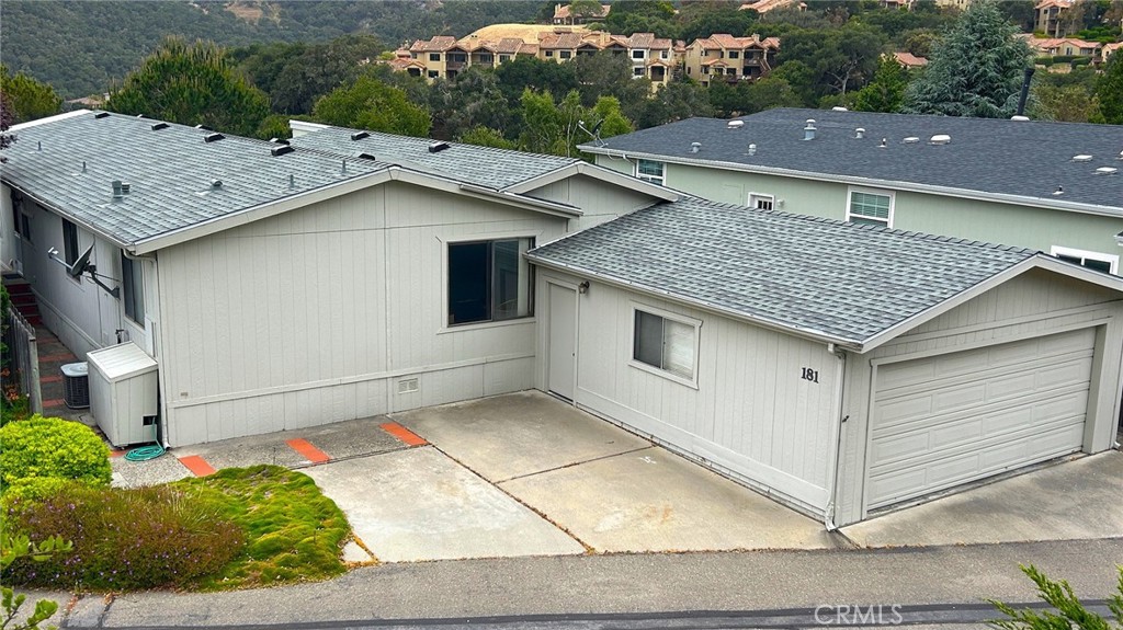Nestled in the beautiful heartbeat of Avila Beach, within the serene, gated San Luis Bay Estates community, the air is crisp, fresh, and filled with the promise of a peaceful day. This cool air-conditioned 1,828 sq. ft. home embodies the Central Coast lifestyle, offering tranquility, elegance, and breathtaking mountain, valley, and sunset views designed for effortless living. Step inside to discover a spacious, open floor plan with abundant natural light, enhanced by vaulted ceilings. This home invites you to create lasting memories as a full-time residence or a relaxing second home…The living and dining areas flow seamlessly into a large, sunroom, providing high ceilings, mountain and valley views, perfect for all seasons; this space is ideal, while enjoying a peaceful retreat, your morning coffee, or watching spectacular sunsets… The expansive primary suite offers a secluded retreat with a private bath where you can wake up every day feeling like you’re on vacation. Step outside to a private deck, a perfect spot for fresh air, good company, a good book, or relaxation…Enjoy the added benefits of the oversized indoor laundry room, office space, plenty of storage, and an extra-large two-car garage and workshop provide even more space for all your needs… This home offers an opportunity to embrace the unmatched lifestyle of Avila Beach and own a slice of paradise on California’s Central Coast, where you can spend more time enjoying the life you desire. …See why Indian Hill is such a unique and inviting place, ready to move right in, or with a little sweat equity, make it your own, and call it home.