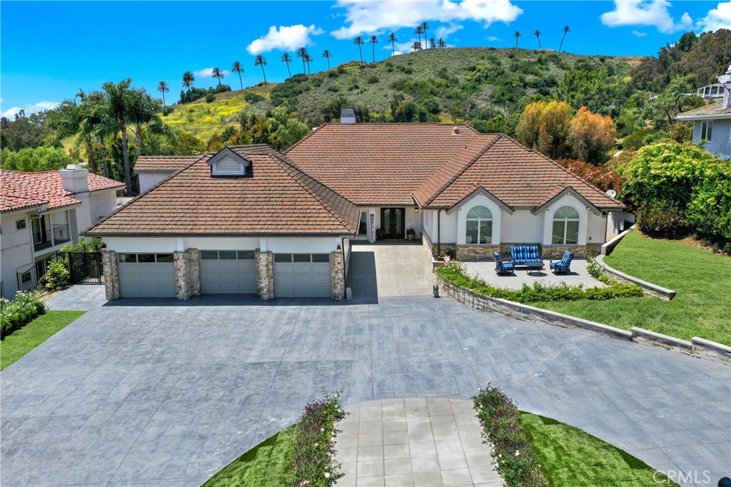 It is my pleasure to introduce the newest listing in the prestigious Hunt Club community located in San Juan Capistrano. This one level home, with ample space for everyone, has everything you need to make memories that will last a lifetime. Let’s begin with the incredibly spacious backyard that is one of a kind. This amazing space does not disappoint for the grandest moments to everyday comforts. Did someone say pickle ball? This is a wonderful venue for hosting your very own pickle ball tournament. A new over-sized pool and jacuzzi ready for lounging in the afternoon full sun or challenge your friends to some water volleyball. The upstairs (270 sqft.) sun deck over looks the backyard. Once the sun does go down, have a seat out by the fire pit and enjoy the evening. Another grand feature in this home is the generously sized California Room. It features a high pitch roof wrapped with beautiful alder wood. Come on in and turn on the fire place and get cozy. Even the master griller has a great view and is close to the kitchen. As you enter the home, the first view is of the incredible architecture with wide arches throughout the main living space with an open and elegant feel. Each living room opens up through bi-folding doors extending to your outdoor living space. The kitchen over looks the main living room and you can see out to much of the back yard, as well as a small view of the ocean. The kitchen has been upgraded with a SUB-ZERO refrigerator, a 5 burner WOLF stove top, BOSCH oven and microwave, a COVE dishwasher, and plenty of storage. The counter tops are Calacata Brasile Leather Quartzite complimenting the slate flooring found throughout the home. A Water Boy water filtration system has been installed bringing clean water all throughout the home. The home has been repiped, new tankless water heaters, new air conditioning units and includes a four person outdoor sauna. The four bedrooms are all spacious with 10.5 foot ceilings. All bedrooms rooms are light and bright. The master bath is chic and elegant. The vanity was hand made special for this very space, including a boutique Juliet soaking tub, and the shower was designed with full height porcelain tile. The entire home has been updated with recessed LED lighting and decorative lighting/fans throughout. In addition there is a fully finished 500 sqft bonus/game room above the garage; all games and furniture can stay with the home. The Hunt Club is gate guarded and patrolled.