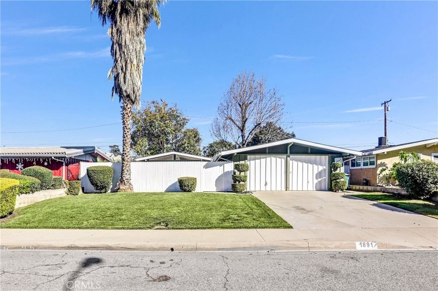 Welcome to 1891 Wright St, Pomona, CA 91766, a stunning Mid-Century Modern residence that has been completely remodeled with high-end finishes and an incredible eye for detail. This home beautifully blends classic architectural charm with modern luxury, featuring an open layout bathed in abundant natural light. The heart of the home is the gorgeous, remodeled kitchen, boasting a massive counter perfect for meal prep and entertaining. The living spaces flow seamlessly, leading to the massive master suite—a true private retreat featuring his and her closets for ultimate convenience. Both restrooms have been meticulously renovated, featuring sleek walk-in showers and premium fixtures. Enjoy total peace of mind and convenience with ALL appliances included: fridge, stove, microwave, and a dedicated indoor laundry area with washer and dryer. Outside, you’ll find a beautifully landscaped exterior featuring a welcoming front yard, a private middle patio ideal for morning coffee, and a spacious backyard for outdoor gatherings. The property also includes a 2-car garage with plenty of storage. Located in a vibrant Pomona neighborhood, you are perfectly positioned for easy commuting with quick access to the 60, 71, and 10 Freeways. You are just minutes away from local favorites and convenient shopping at the Rio Rancho Towne Center, featuring Target, Walmart, and various dining options. Truly a turn-key Mid-Century gem!