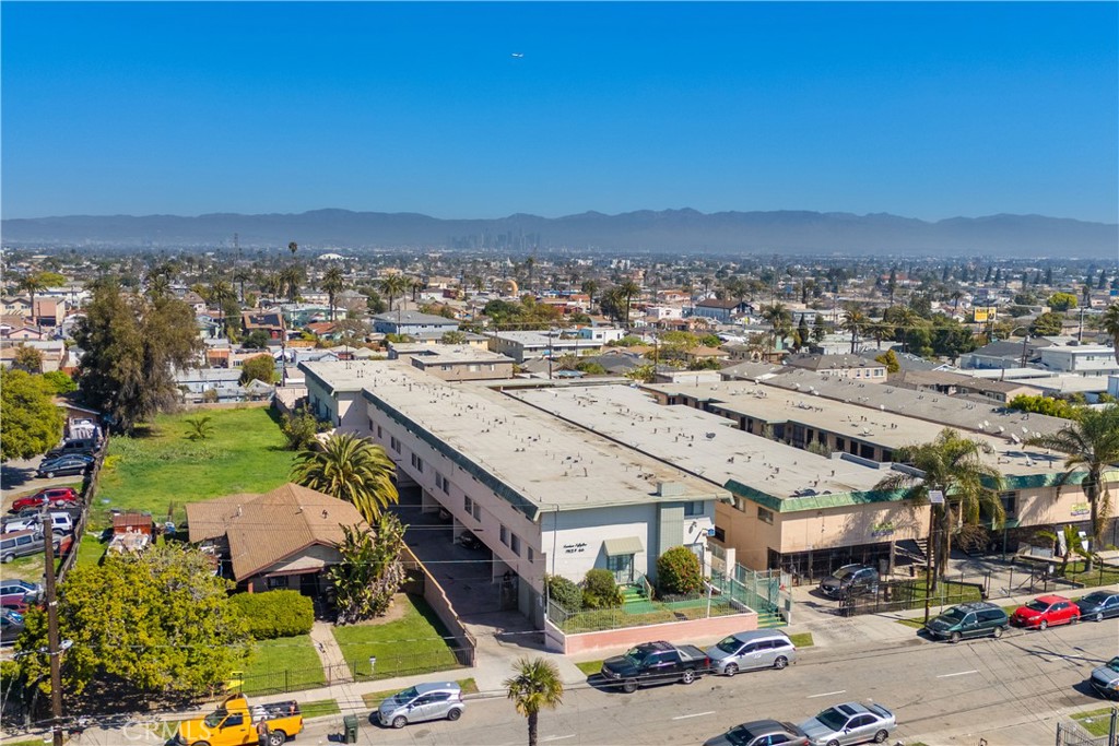 We are proud to present 1451 W 105th St, Los Angeles — a rare, family-owned asset held for over 51 years, located in a designated Opportunity Zone. This well-maintained, 18-unit apartment building features all townhome-style units, including seventeen (17) 2-bedroom, 1.5-bath units and one (1) spacious 3-bedroom, 2.5-bath unit. Originally built in 1963, the property encompasses 19,425 square feet and sits on a generous 19,063 square foot lot. Recent upgrades include a modern video security system and the completion of a soft-story seismic retrofit. Residents enjoy well- designed, spacious units, onsite laundry facilities, and secure underground parking. With strong in-place rental income and approximately 30% rental upside, this property offers an exceptional value-add opportunity for investors. Ideally located just 2 miles from a Metro Rail stop, near major shopping centers, and minutes from the newly developed Hollywood Park—home to the NFL and NBA stadiums—this location combines convenience with long-term growth potential. Bonus Opportunity: The adjacent lot at 1455 W 105th St is also available for sale. Listed as land for $1,275,000 $66.86/ft), this 19,068 square foot parcel is situated in an Opportunity Zone and presents significant potential for affordable housing development. SELLER FINANCING CONSIDERED.
