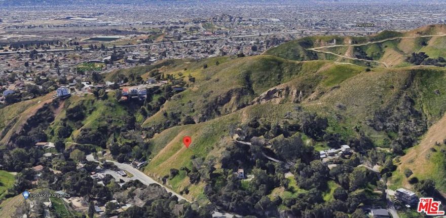 Unique opportunity, two adjacent lots!!! Creating a huge frontage on Kagel Canyon Road, across from 12146 Market Trail. Close to the Hideaway restaurant. Beautiful setting, mature trees. Must be sold with APN 2526-006-034.