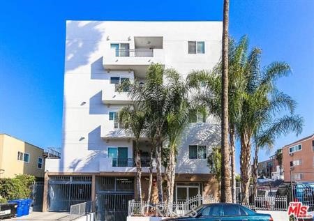 Well-designed 3-bed + 2-bath condominium on a quiet street in the heart of Koreatown. This home offers a functional layout with a spacious open-concept living and dining area connected to the kitchen, featuring laminate hardwood flooring. The gourmet kitchen includes a center island, granite countertops, and stainless steel appliances. Bedrooms are generously sized, bright, and include plenty of closet space with carpet flooring. The master suite also features a small balcony with rooftop views. Both bathrooms are nicely sized with tile flooring. Additional highlights include a separate laundry room and two-car tandem gated parking. Conveniently located near major metro stops and just minutes from downtown L.A., restaurants, shopping, and entertainment. A great opportunity to live in one of the most desirable neighborhoods!