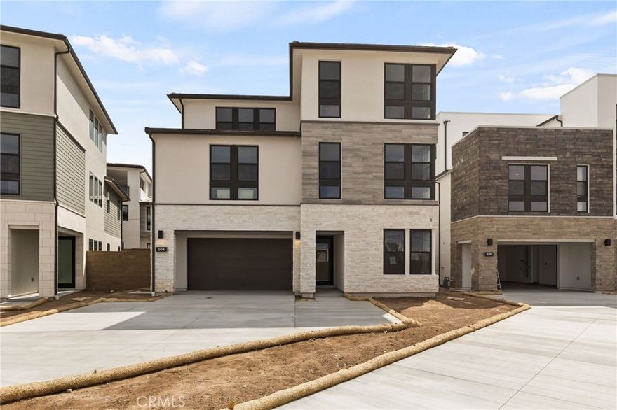 Welcome to Elevate, a new community located in Great Park Neighborhoods in Irvine.  Move-in ready homesite 71 is a new construction home that is situated on a prime cul-de-sac location with a generously sized driveway for added privacy and parking.   The Melina floorplan features 6 bedrooms, with 5 bathrooms, and is 3,892 sq. ft, with a 2-car garage.  Upon entering the home provide a brief description, the kitchen features provide a brief description.  Highlight includes soaring 20' ceilings in the great room, a gourmet kitchen with WOLF appliances, a Sub-Zero refrigerator, and designer-selected finishes throughout. The primary retreat offers a spa ensuite bathroom and spacious closet. The secondary bedrooms on the second floor are all en-suite. This multi-gen floorplan offers third-floor loft with a private deck, two bedrooms, and full bathroom—perfect for entertaining or creating a quiet escape. Solar System included(purchased). Ideally located within walking distance to Cadence Park School (K-8) and Portola High School, and adjacent to the new Great Park Framework with trails, lakes, a museum, and more. Easy access to freeways and shopping.