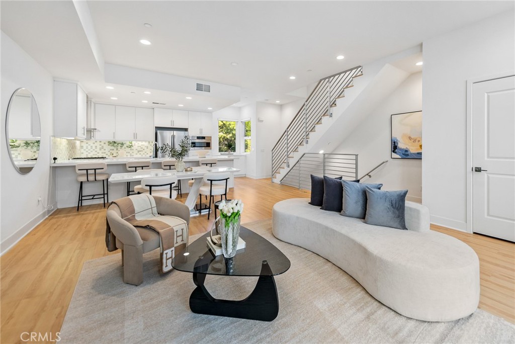 Welcome to 3306 Aria Lane, the premier residence in one of West LA’s most sought-after modern communities. This spacious 3-bedroom, 3.5-bath tri-level home is filled with natural light and enjoys sweeping panoramic views. An ultra-modern layout centers around a sleek chef’s kitchen with high-end appliances, while a rare downstairs bedroom adds flexibility as a guest suite or private office. Multiple outdoor spaces provide endless options for entertaining and relaxation-including a private rooftop deck that serves as a true oasis for enjoying LA’s vibrant sunsets. Located just blocks from Downtown Culver City- walk or bike to shopping, dining, and nightlife, with quick access to the 10 and 405 freeways for an easy commute to Santa Monica, Downtown LA, and LAX. This is modern LA living at its best!
