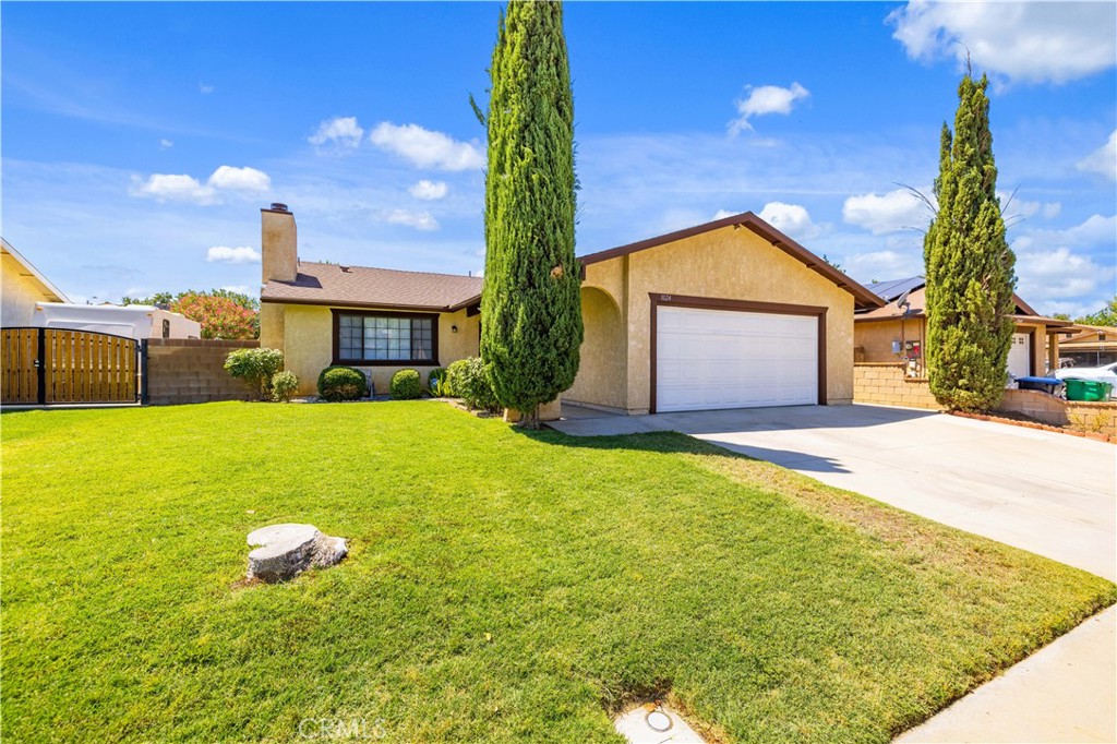 Charming Single-Story Home with Modern Updates This 1,422 sq. ft., single-level home offers 3 bedrooms, 2 bathrooms, and a 2-car garage, built in 1986. Recent updates include fresh interior paint, new laminate flooring, and oversized baseboards. The kitchen features quartz countertops, a butcher-block center island, custom cabinetry, and brand-new stove, dishwasher, and microwave. For added convenience, the refrigerator and washer/dryer are included. The living room boasts a cozy fireplace, while both bathrooms have been upgraded with new lighting, vanities, and toilets. The primary bedroom is spacious, features a ceiling fan, and includes newer mirrored closet doors. All bedrooms and the living room have blinds installed. Major home systems have been taken care of with a recently replaced air conditioner, tankless water heater, and roof. Outside, enjoy an established lawn, mature trees, and a serene backyard with a covered patio—perfect for relaxing or entertaining.