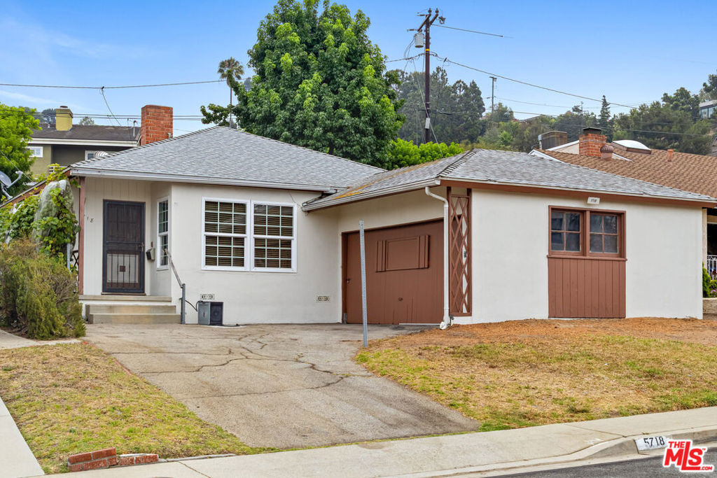 With a great location at the foot of Culver Crest, this one-story ranch style home provides a great opportunity to remodel or build a new home on a quiet street in a great location. The home is in need of some tender loving care but affords a new owner the chance to remodel or start anew. The functional floorplan features an entry with a guest closet, a living room with a fireplace, a small dining area, and a galley style kitchen. There are three full-sized bedrooms and there is an office attached to the rear bedroom providing the opportunity to expand that bedroom into a true primary suite. The full bath is located off the main hallway and there is a bath located next to the service porch. Parking is provided in an attached two-car garage plus driveway parking. In the rear is a private yard and open patio. First time on the market in many decades. Culver City schools and services.