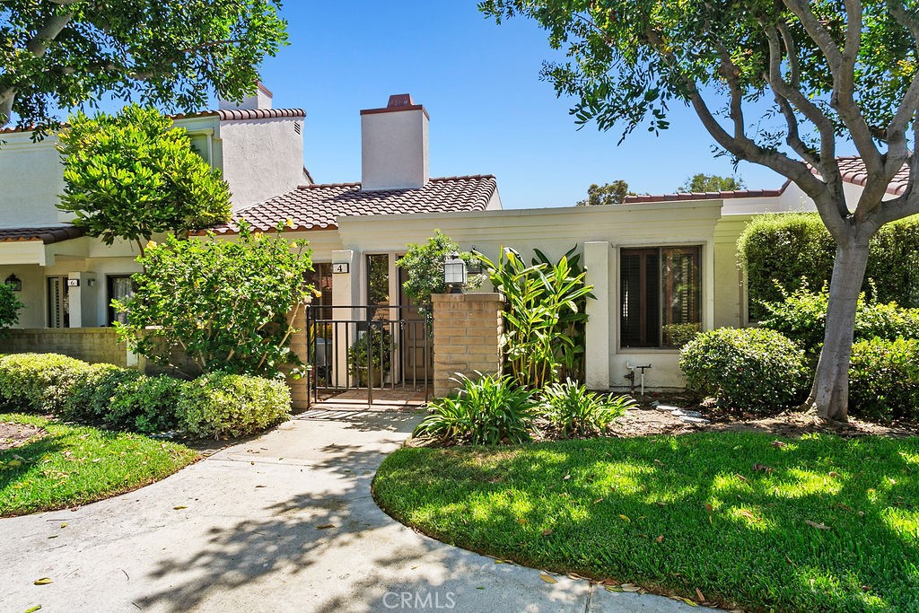 4 Navarre is in the San Joaquin Villas neighborhood of Irvine. It is a 2 bedroom, 1.5 bath home all on single level with no stairs. This home features cool travertine floors throughout with no carpet. Vaulted ceilings in the living room and dining room have south facing windows bringing in abundant light with remote control window shades. The home is bright and cheerful all day long and cool in the summer with AC. The home features an atrium off the main bedroom and kitchen that is completely private, enclosed and shaded for easy outdoor living, working and relaxing. A large main bedroom and bath has new tile and skylight that opens to let in the air and sunlight. The redone kitchen features stainless steel appliances, an ample pantry and laundry room adjacent. It's just a close walk to the 2 car garage and community swimming pool. Rancho San Joaquin Villas features ample parking and lovely sidewalks shaded by mature trees. With a bikeability score of 77, this home is moments from UCI, University Town Center, an Irvine Senior Center, San Joaquin Golf Course, Racquet Club of Irvine, University Park Shopping Center, nationally recognized schools, public library and award-winning parks. Bay breezes waft up from San Diego Creek and the home is freeway close, but upwind of the 405. If you are looking for an easeful home with a perfect climate and location, you will want to see this home.
